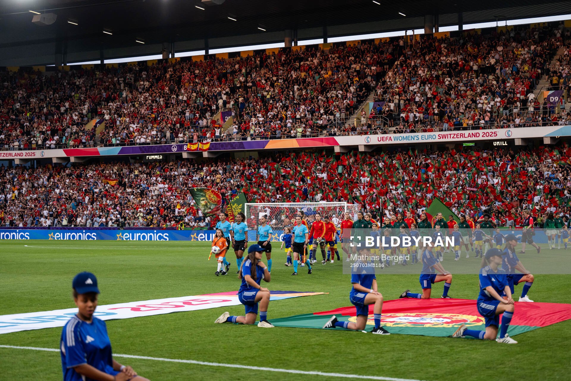 Players of Spain and of Portugal enter the arena