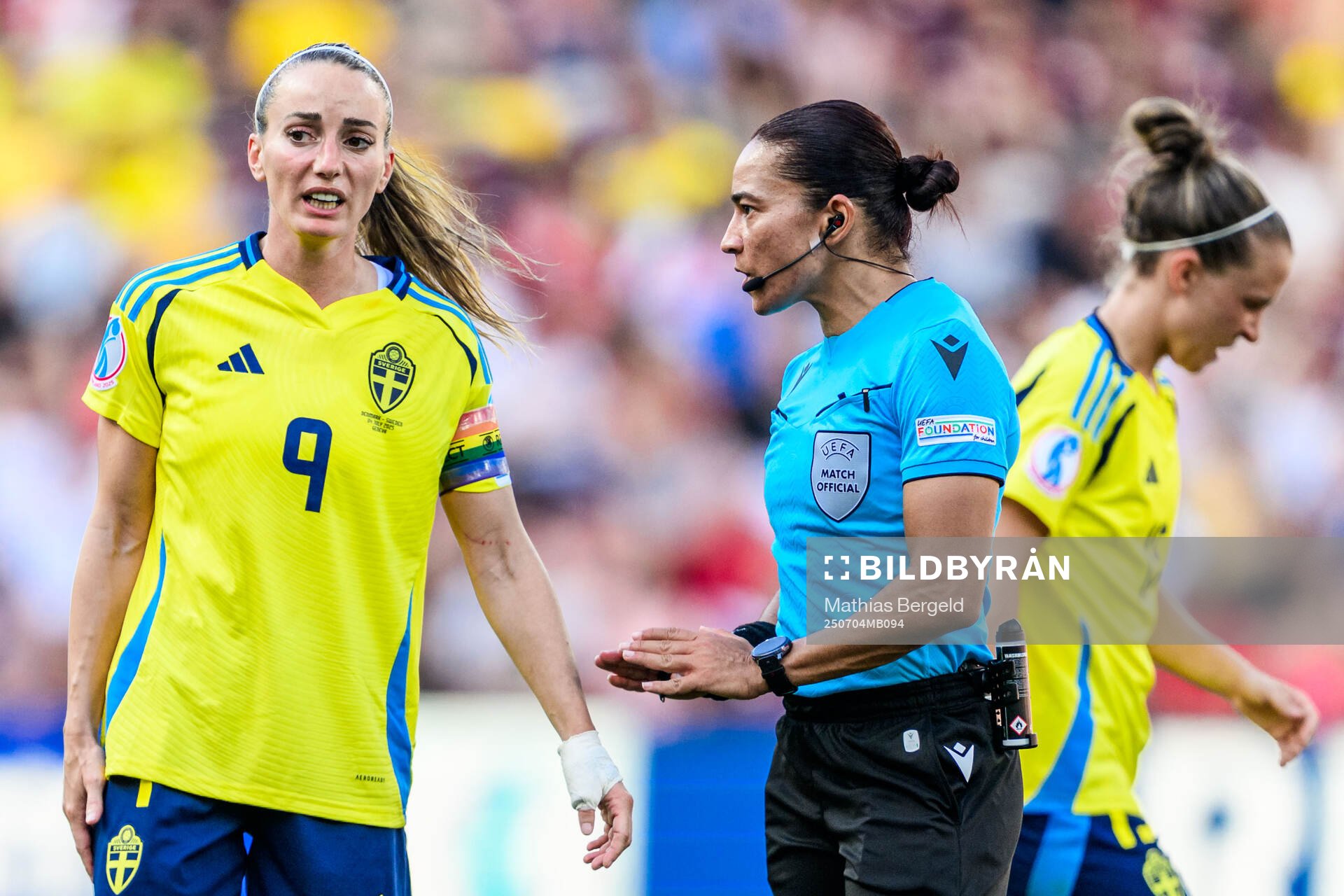 Kosovare Asllani of Sweden and Referee Edina Alves