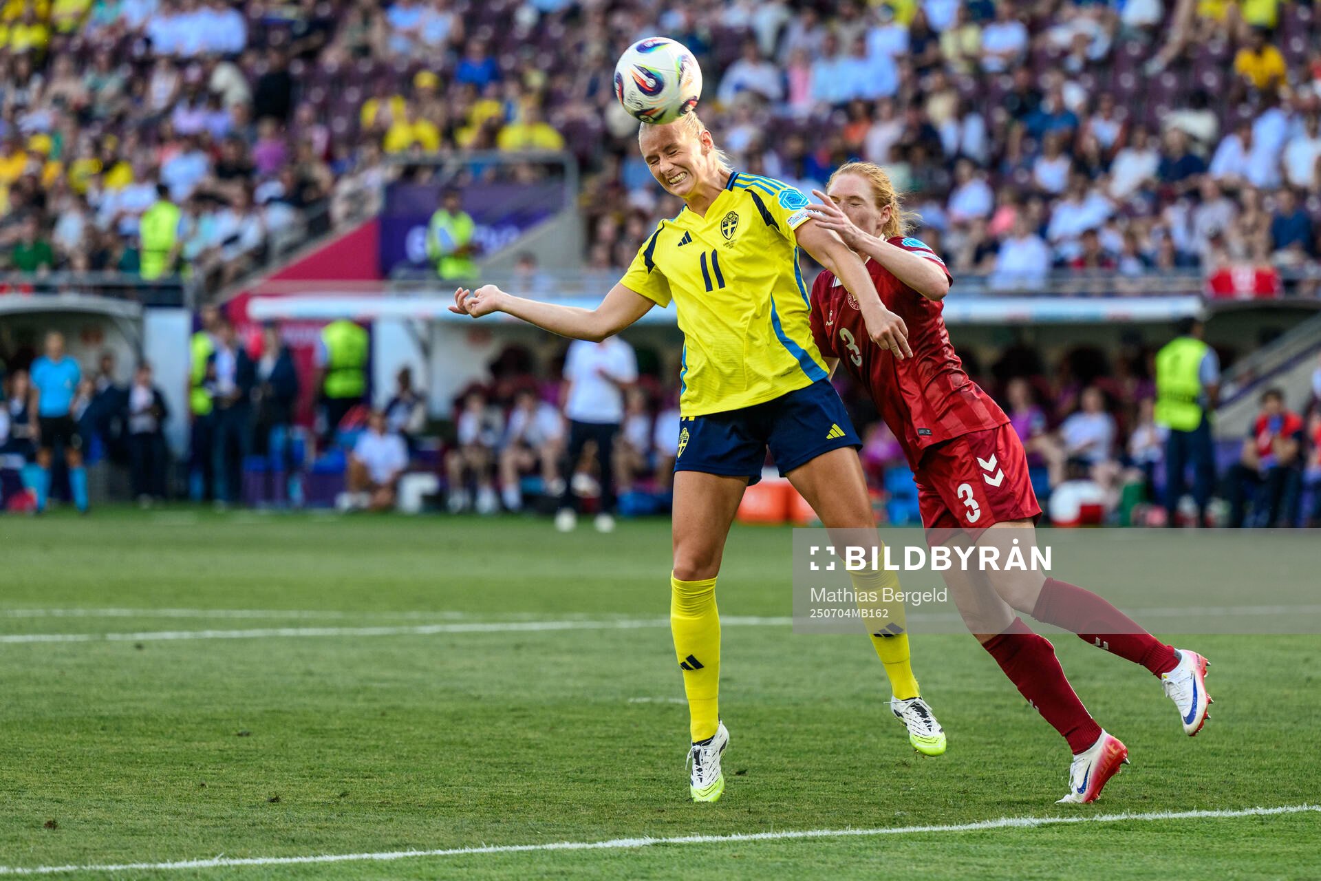 Stina Blackstenius of Sweden and Stine Ballisager of Denmark