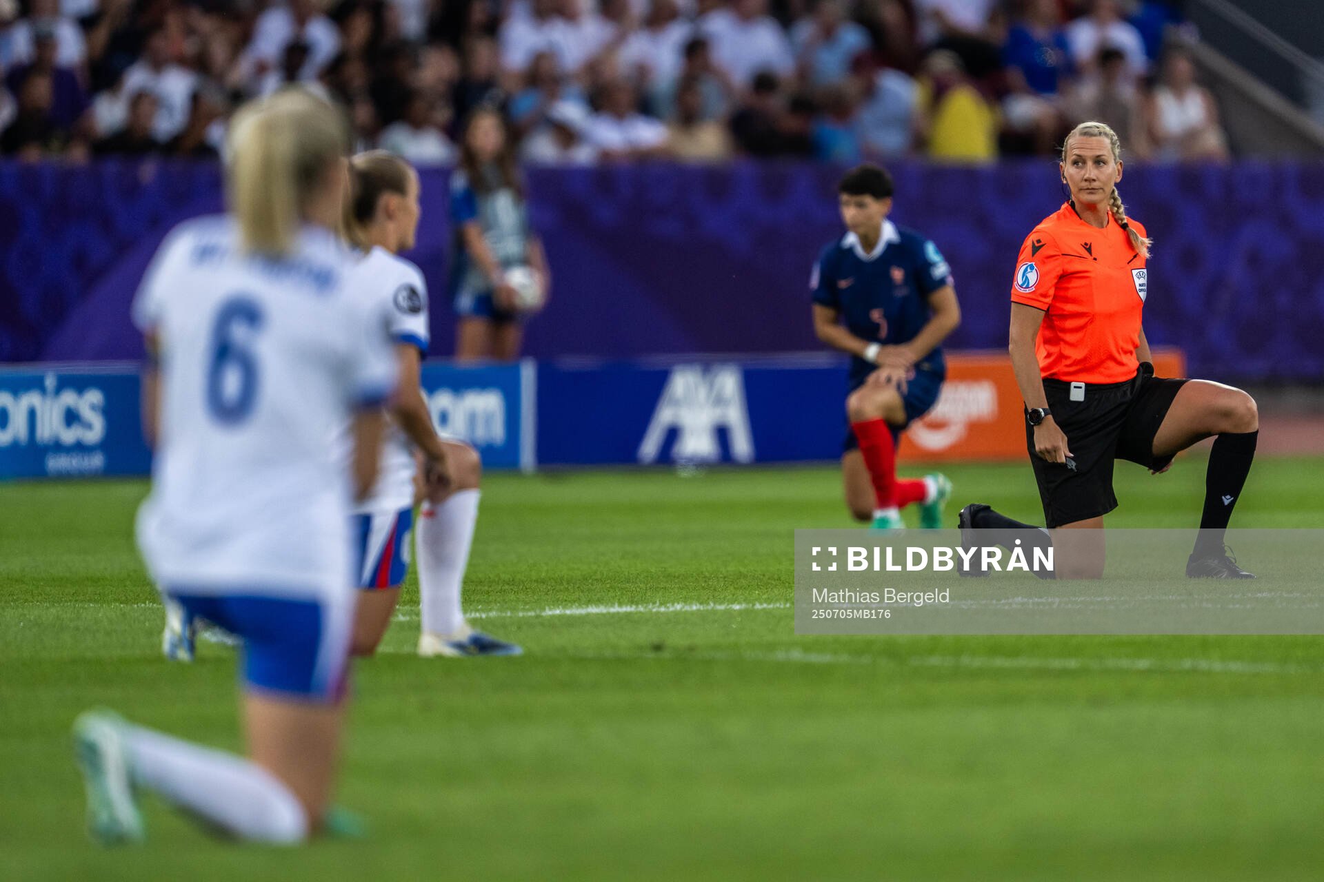 Referee Tess Olofsson takes a knee