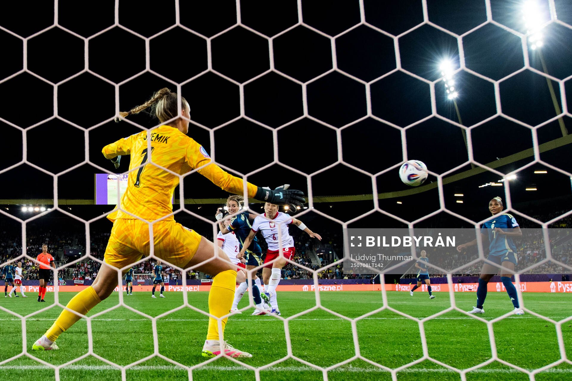 Kosovare Asllani of Sweden scores 0-2 behind goalkeeper