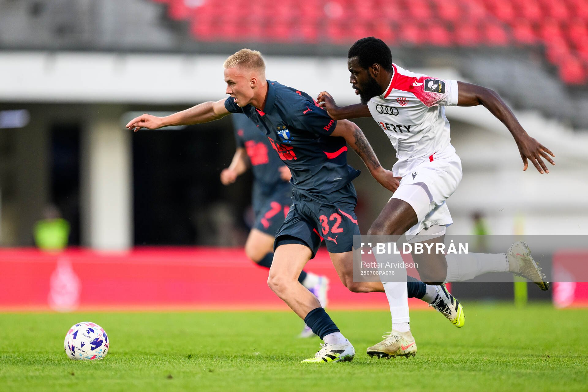 Daniel Gudjohnsen of Malmö FF and Dhoraso Moreo Klas of FC