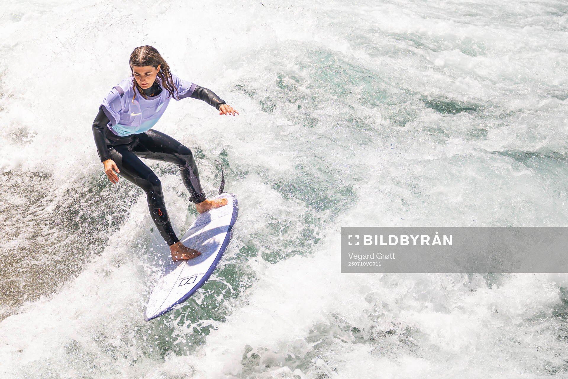 A surfer with the Norwegian away kit