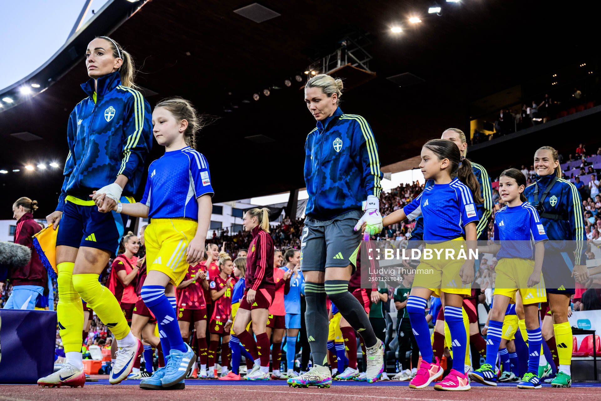 Kosovare Asllani and goalkeeper Jennifer Falk of Sweden