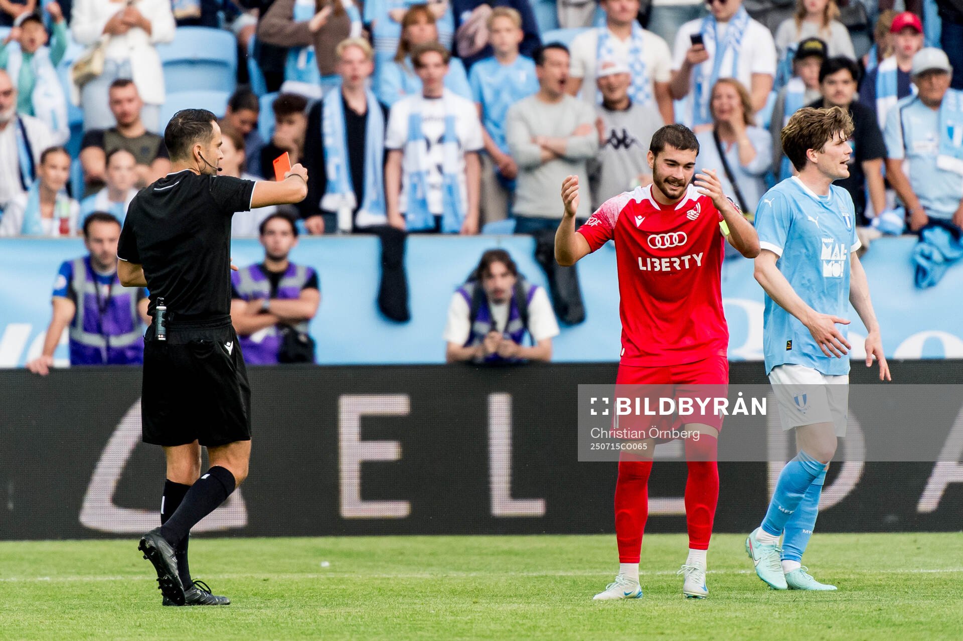 Gizo Mamageishvili of FC Iberia is shown a red card from