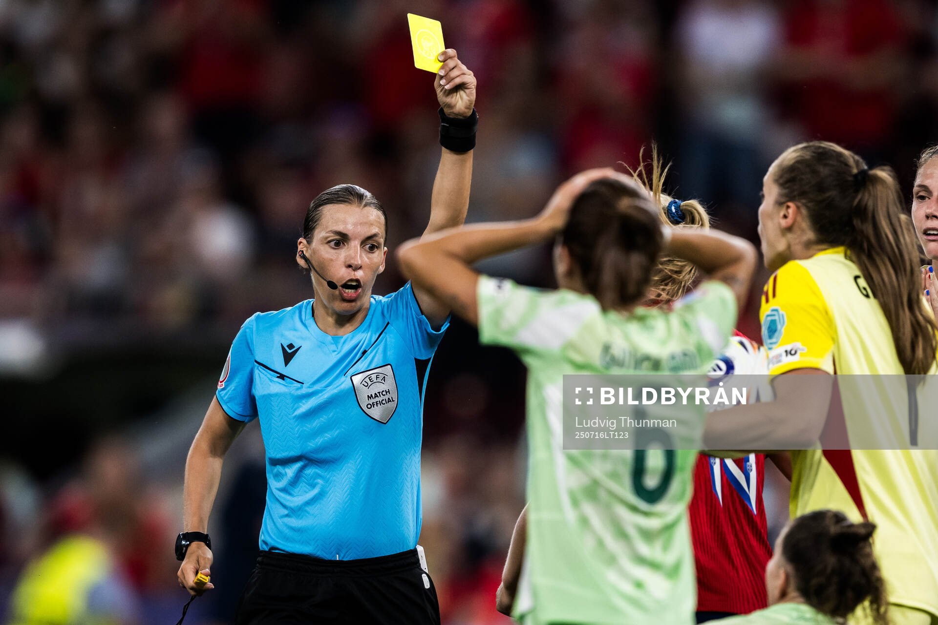 Manuela Giugliano of Italy is shown a yellow card from