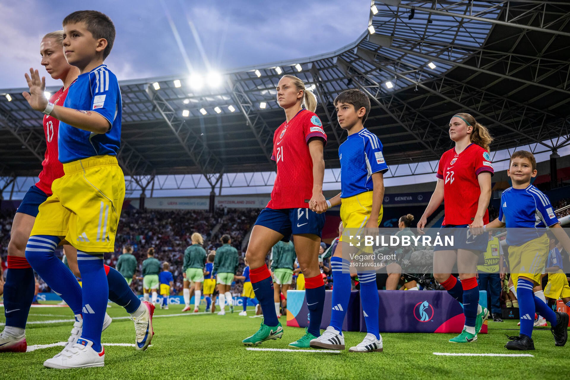 Lisa Naalsund and Signe Gaupset of Norway enter the pitch