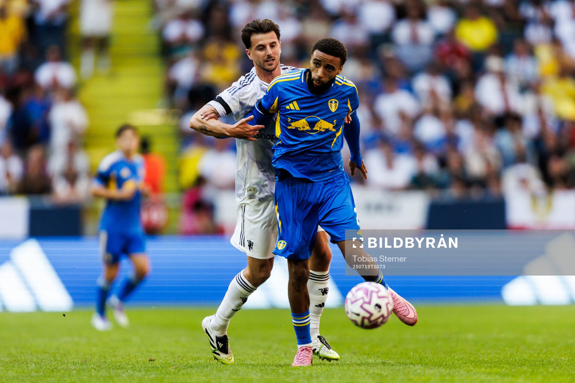 Manuel Ugarte of Manchester United and Jayden Bogle of