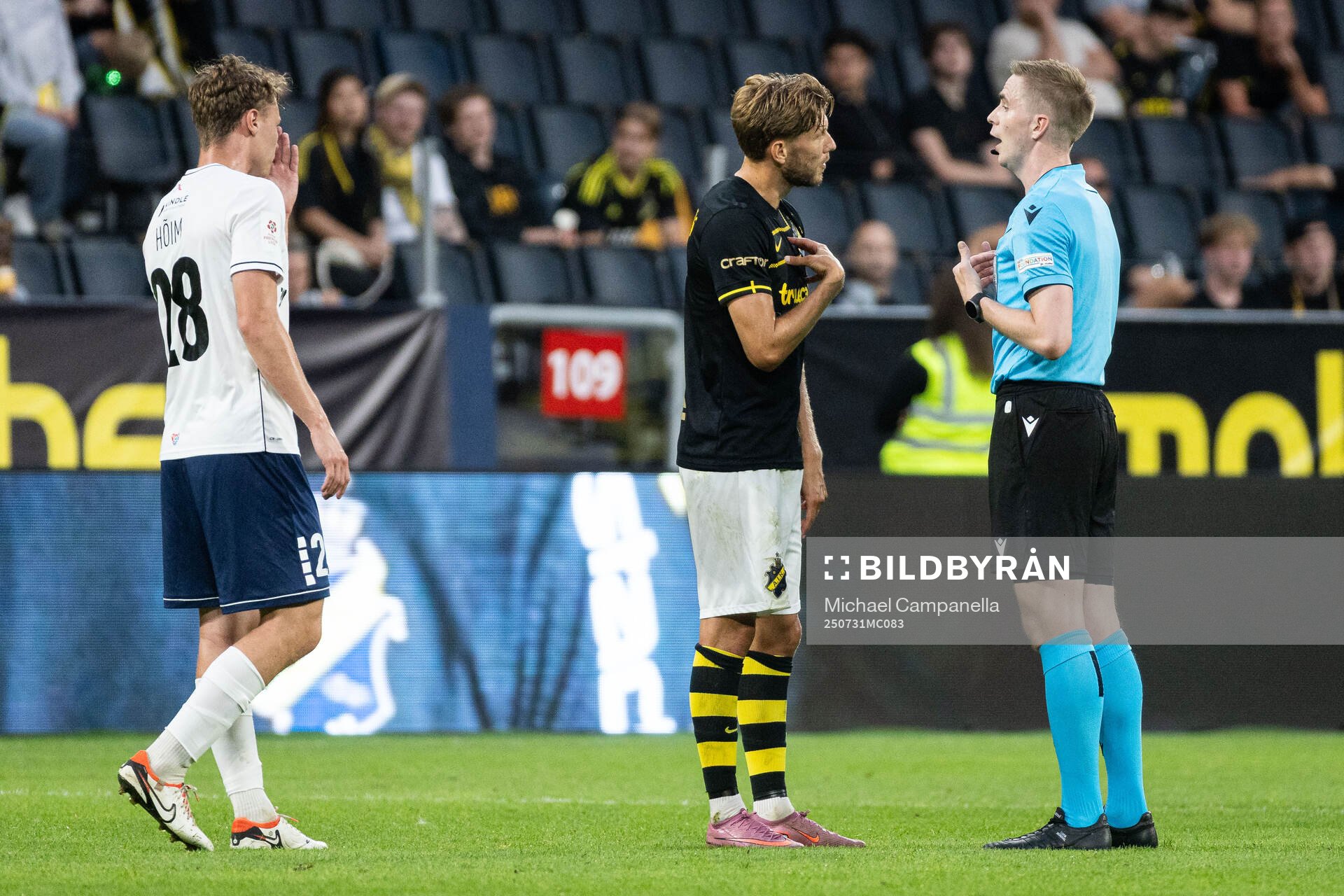 Anton Salétros of AIK speaks with referee Helgi Mikael