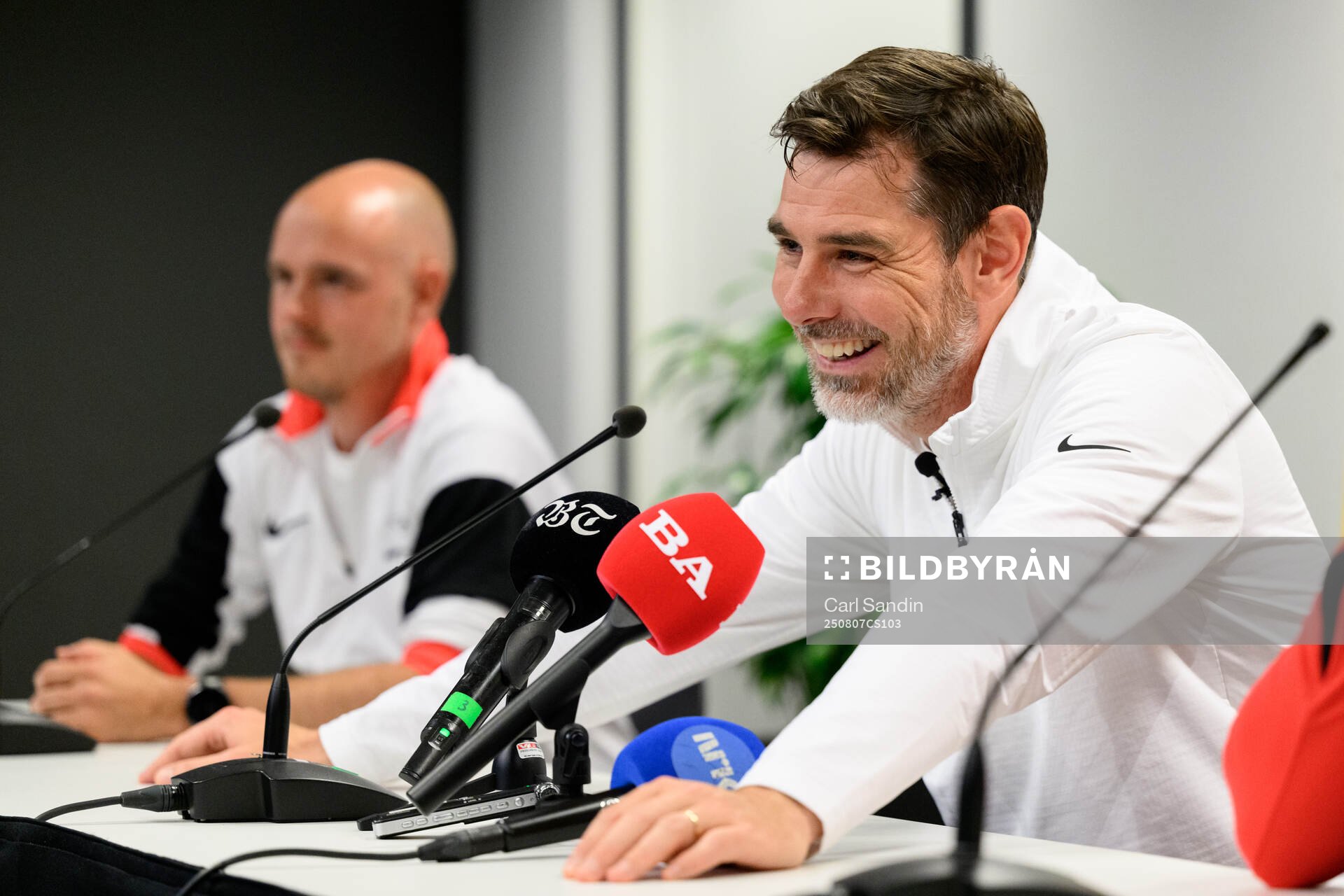 Coach Freyr Alexandersson at a press conference