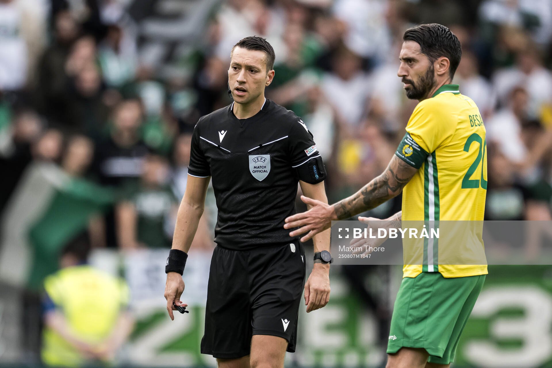 Referee Zorbay Kucuk and Nahir Besara of Hammarby