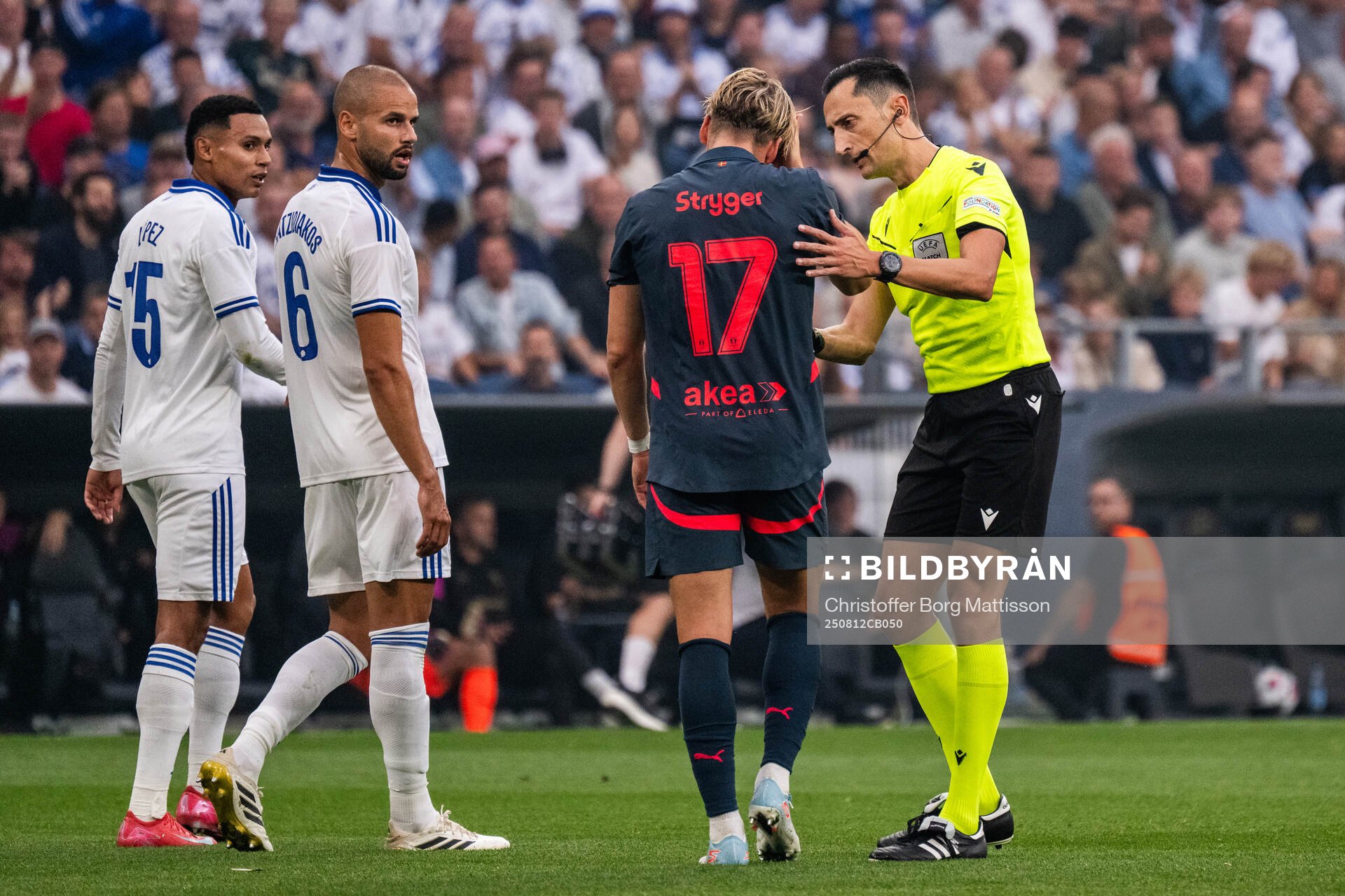 Jens Stryger Larsen of Malmö FF and referee José María