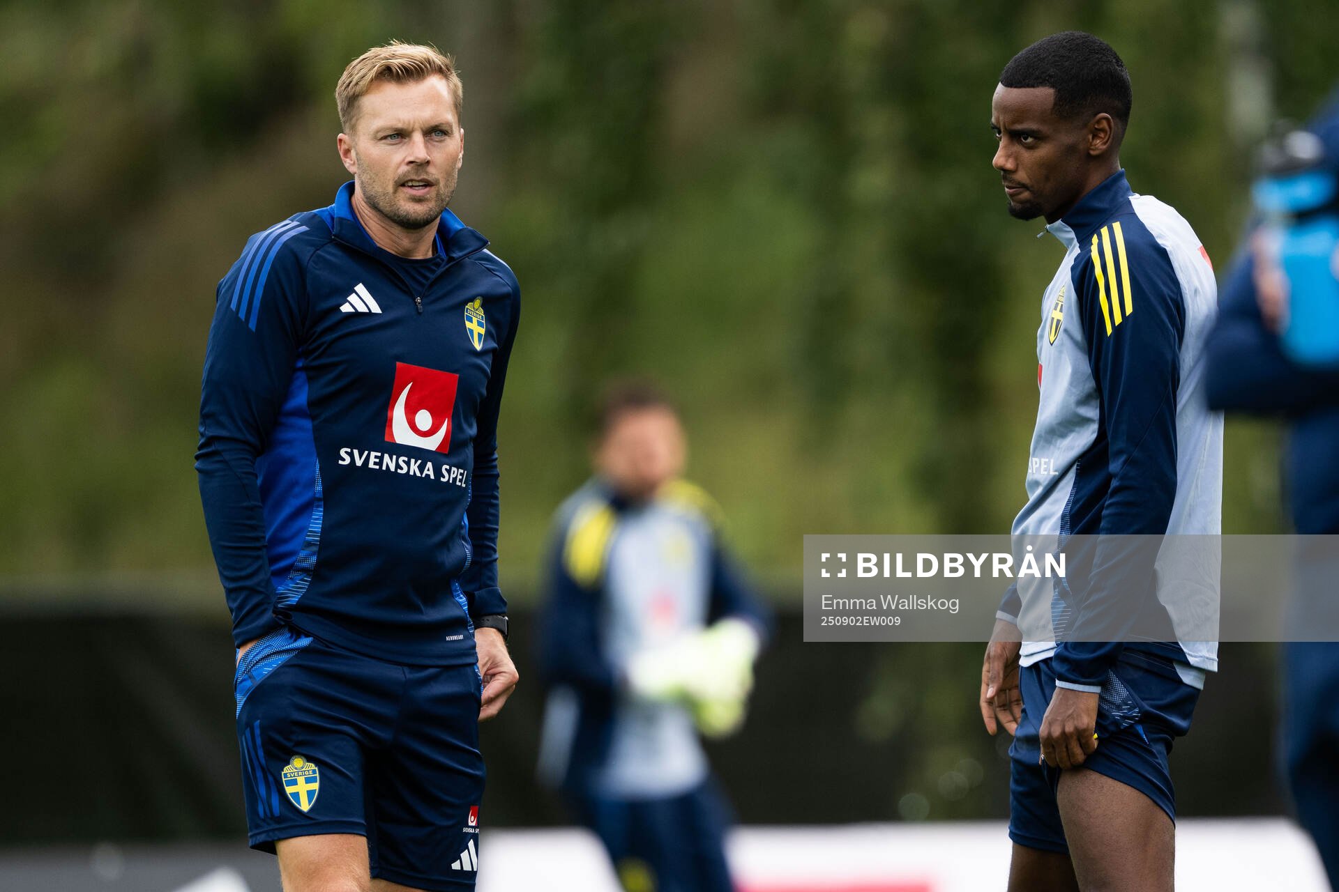 Assistant coach Sebastian Larsson and Alexander Isak of the