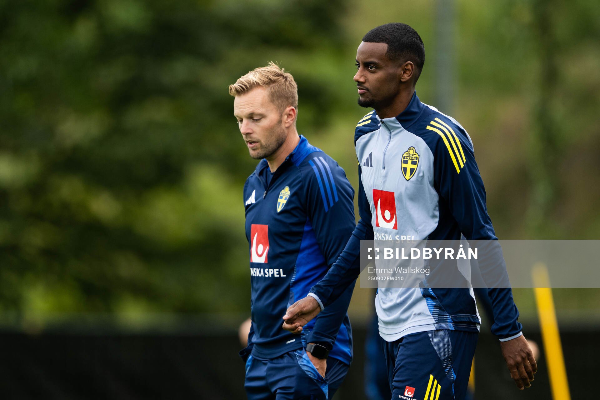 Assistant coach Sebastian Larsson and Alexander Isak of the