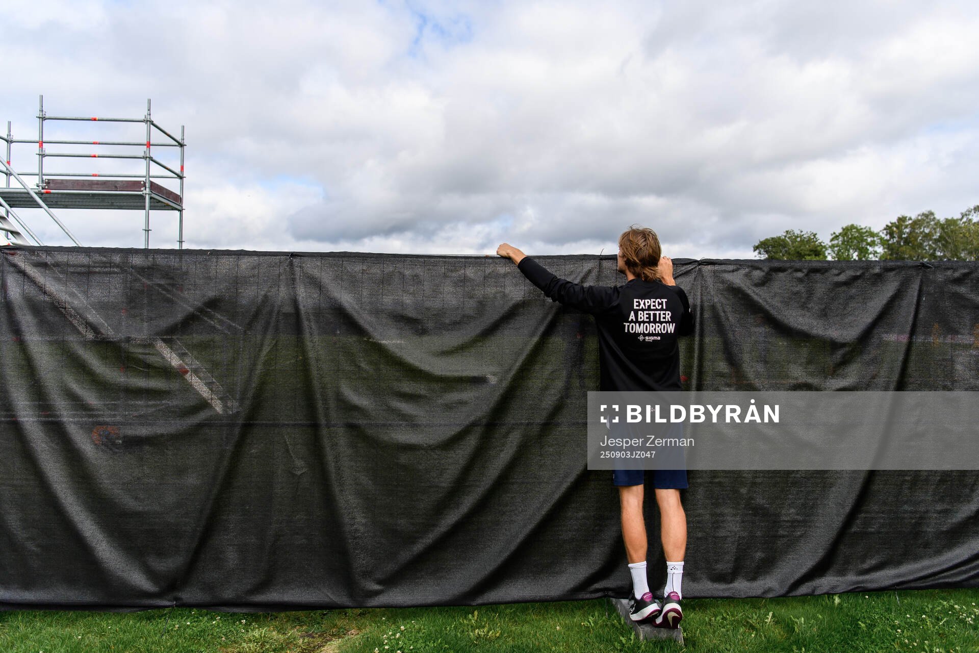 A spectator watching the training session from outside the