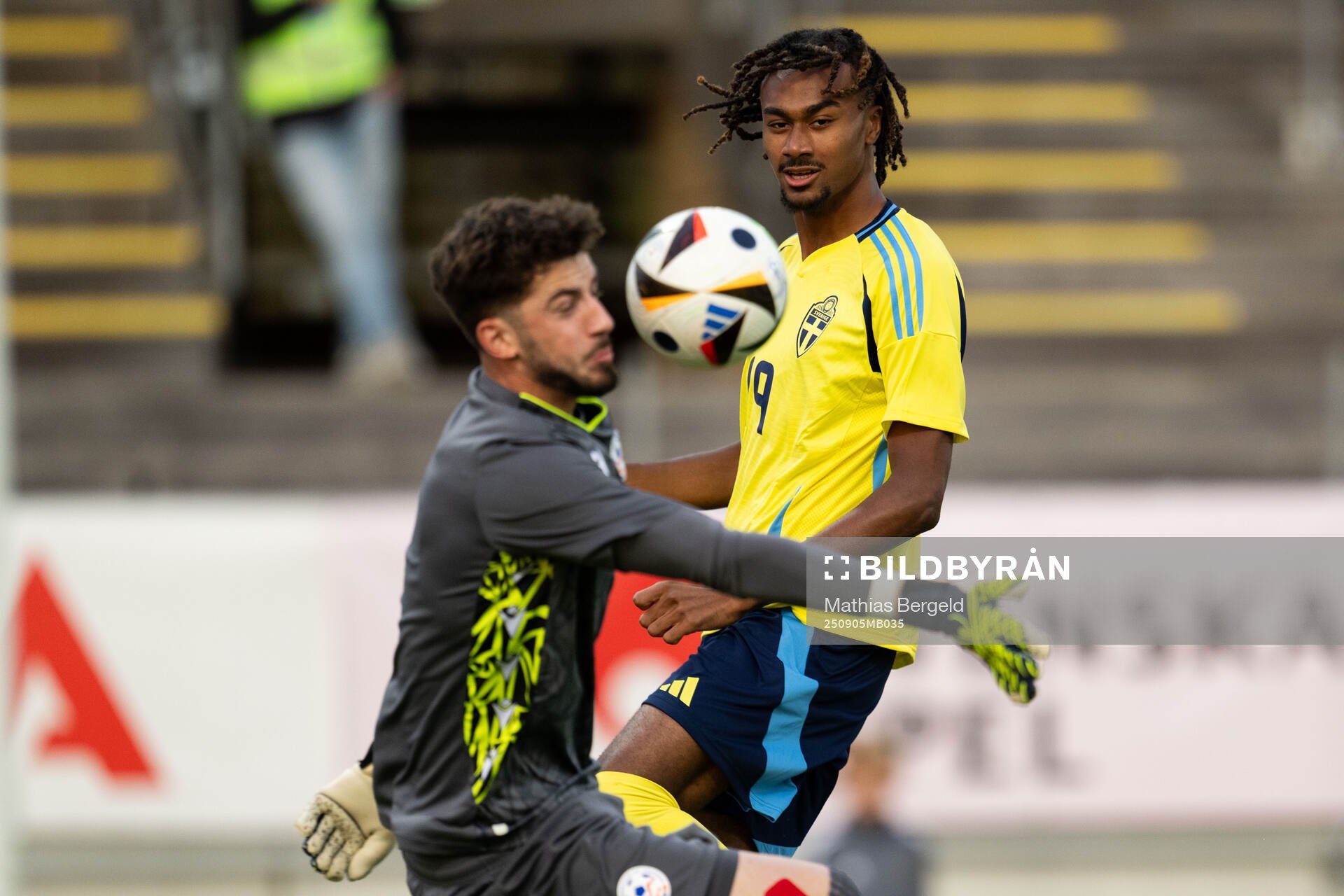 Jonah Kusi-Asare of Sweden scores 1-0 behind goalkeeper Gor