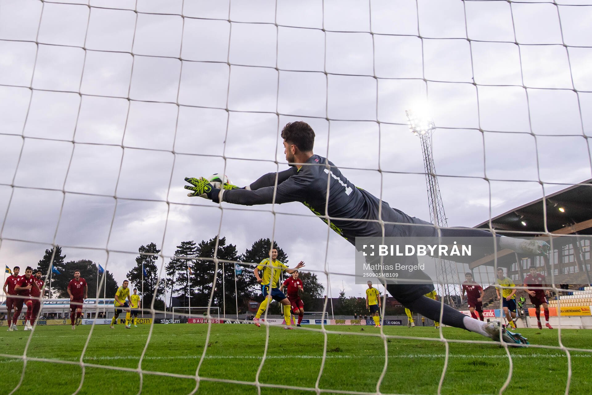 Aoalkeeper Gor Matinyan of Armenia saves a penalty from