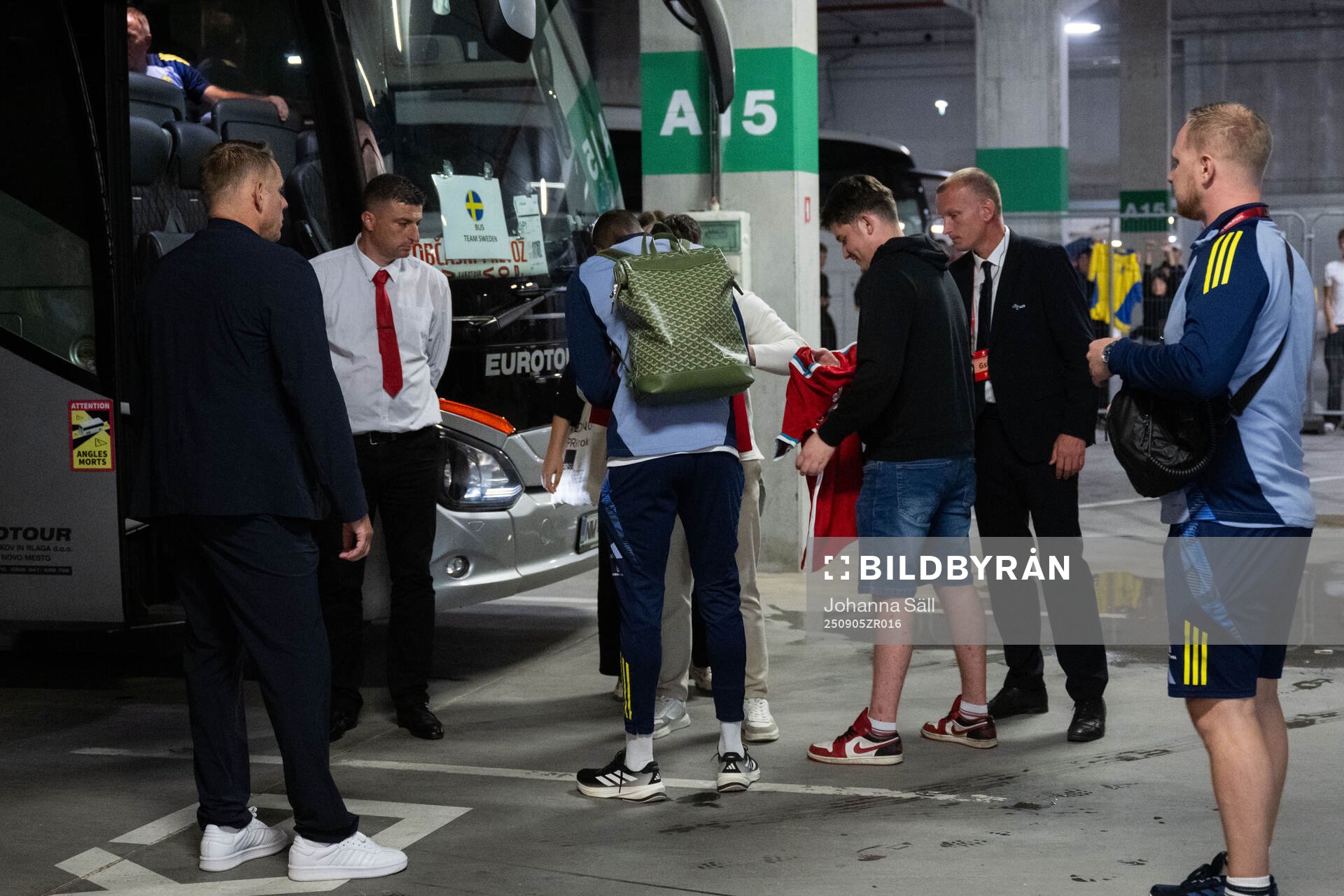 Alexander Isak of Sweden writes autographs to fans
