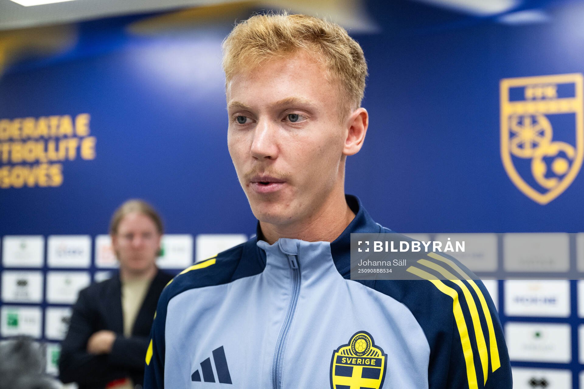 Hugo Larsson of Sweden in mixed zone