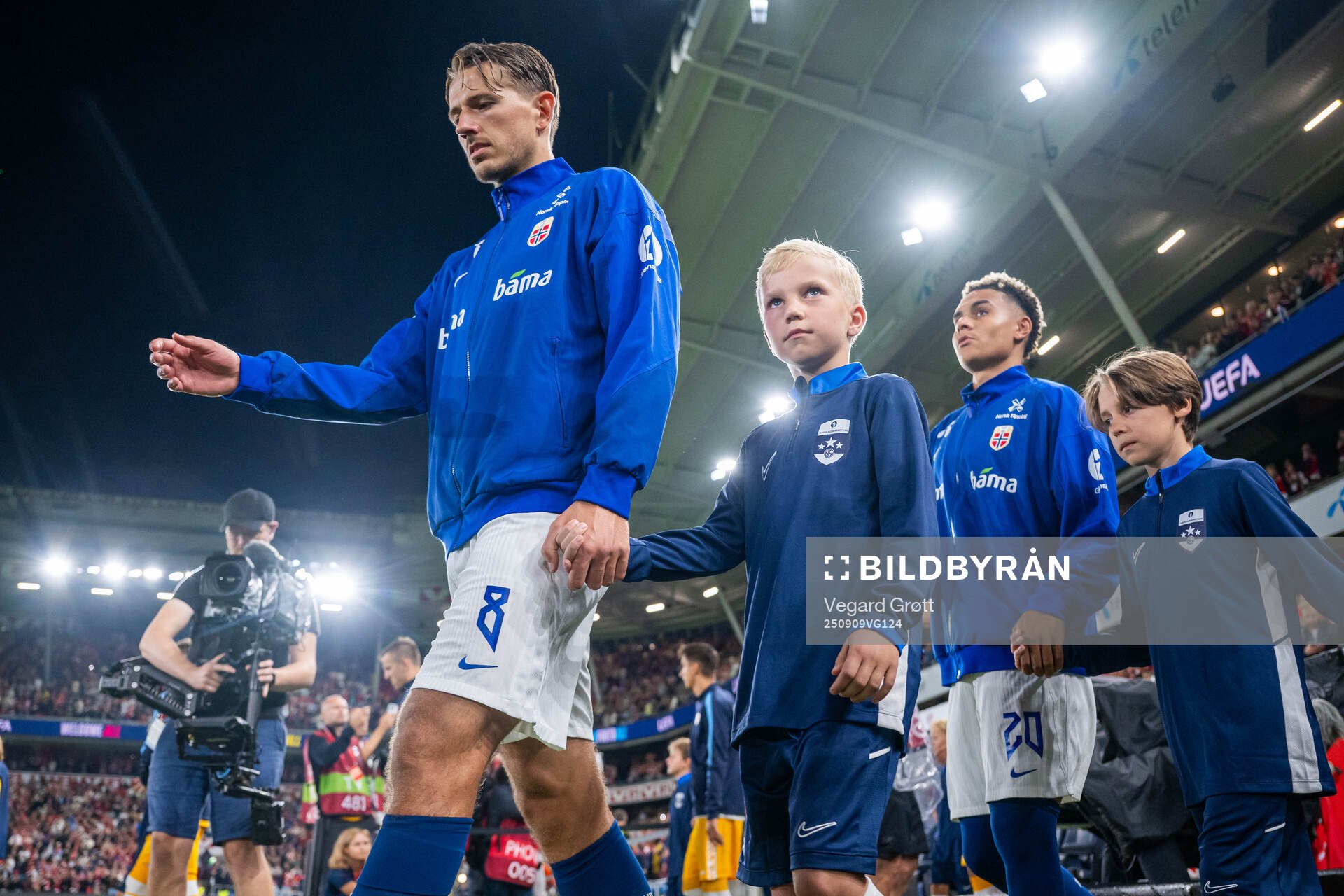Sander Berge and Antonio Nusa of Norway enter the pitch