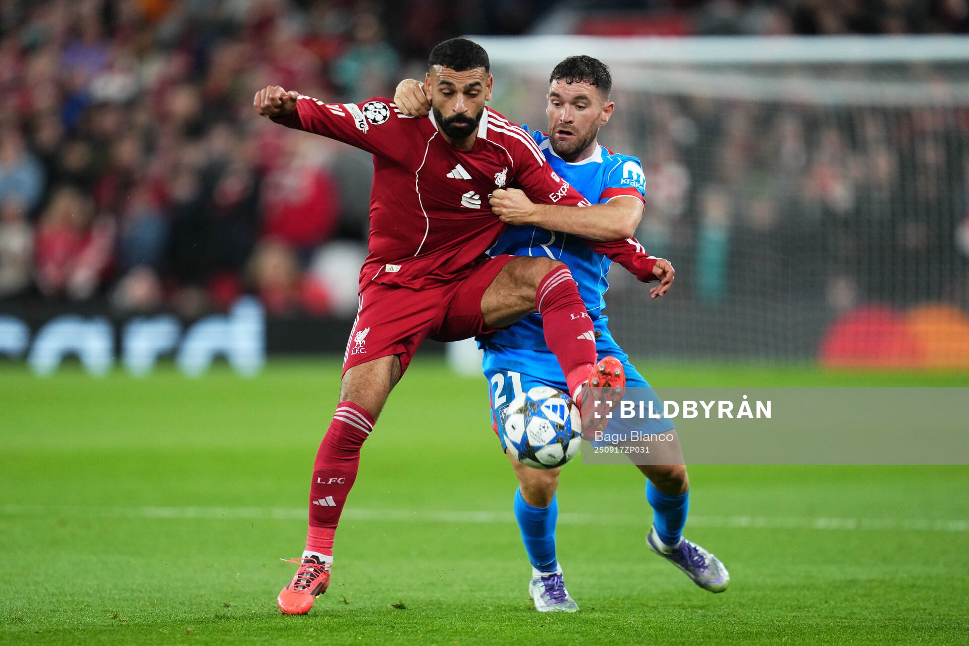 Mohammed Salah of Liverpool and Javier Galán of Atletico