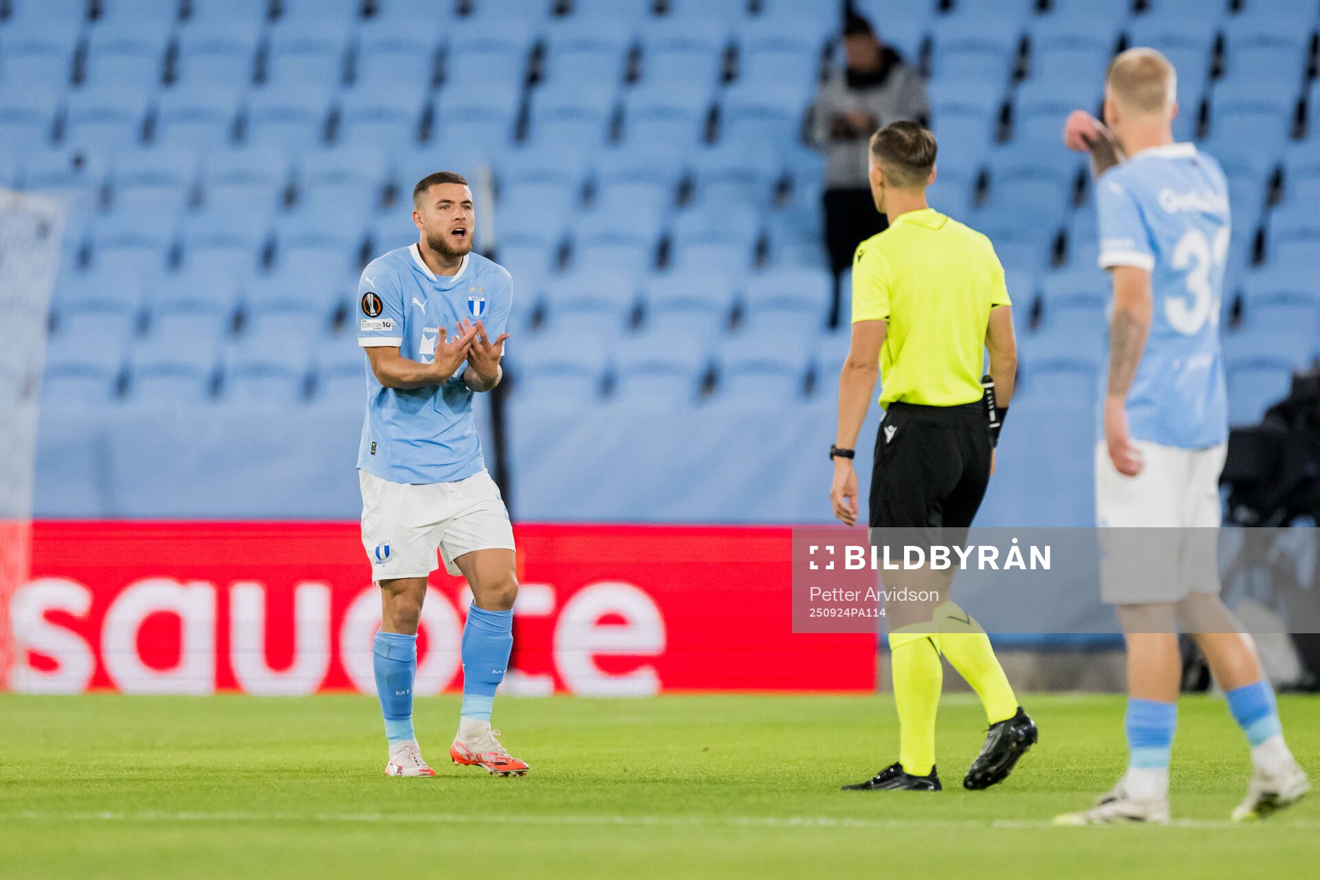 Gabriel Busanello of Malmö FF and referee Manfredas