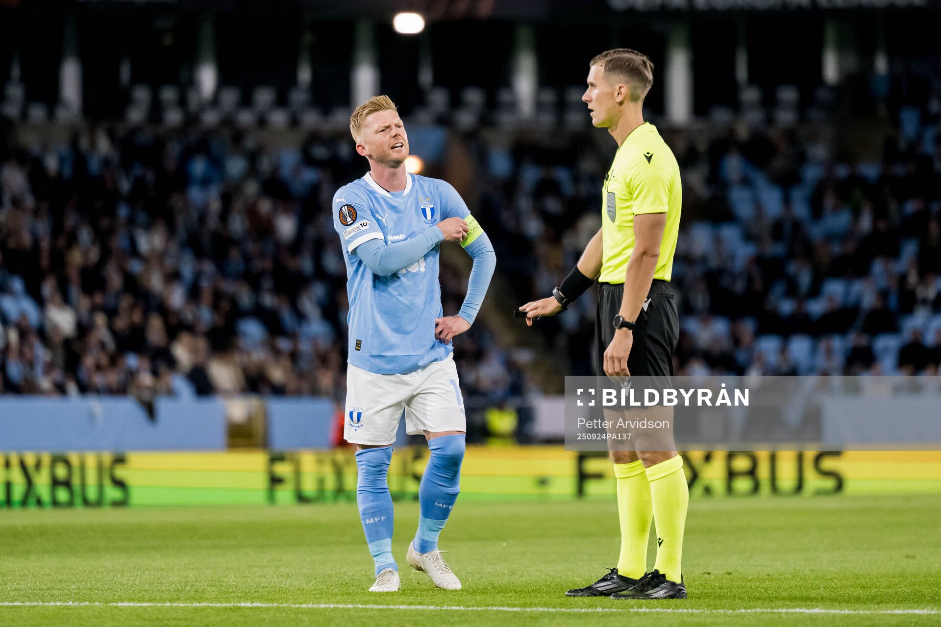 Anders Christiansen of Malmö FF and referee Manfredas