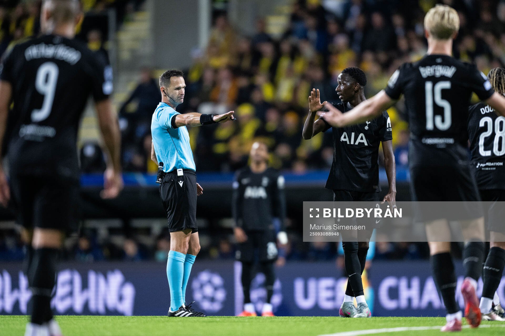 Referee Ivan Kruzliak and Pape Matar Sarr of Tottenham