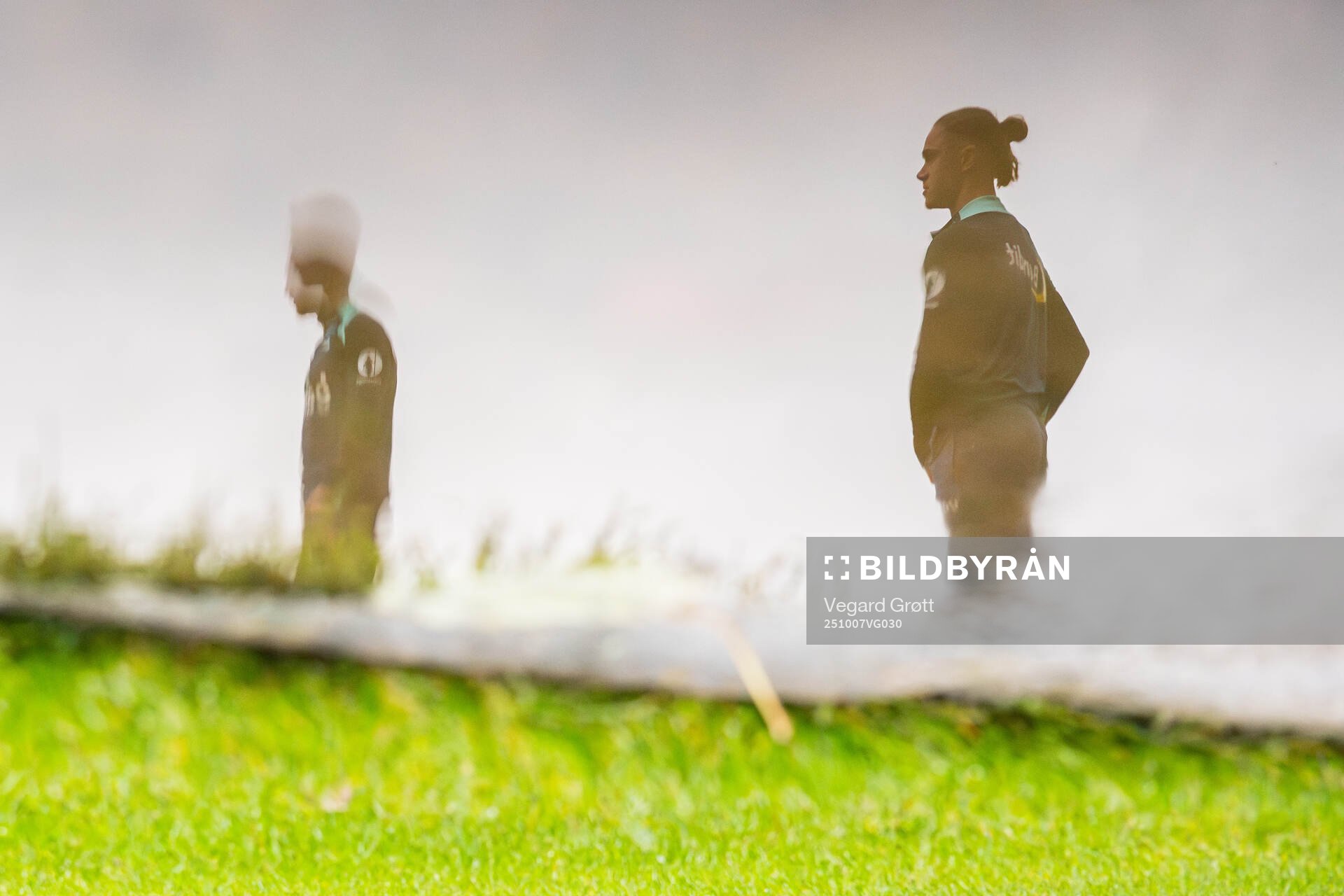 The reflection from a water puddle of Thelo Aasgaard of the