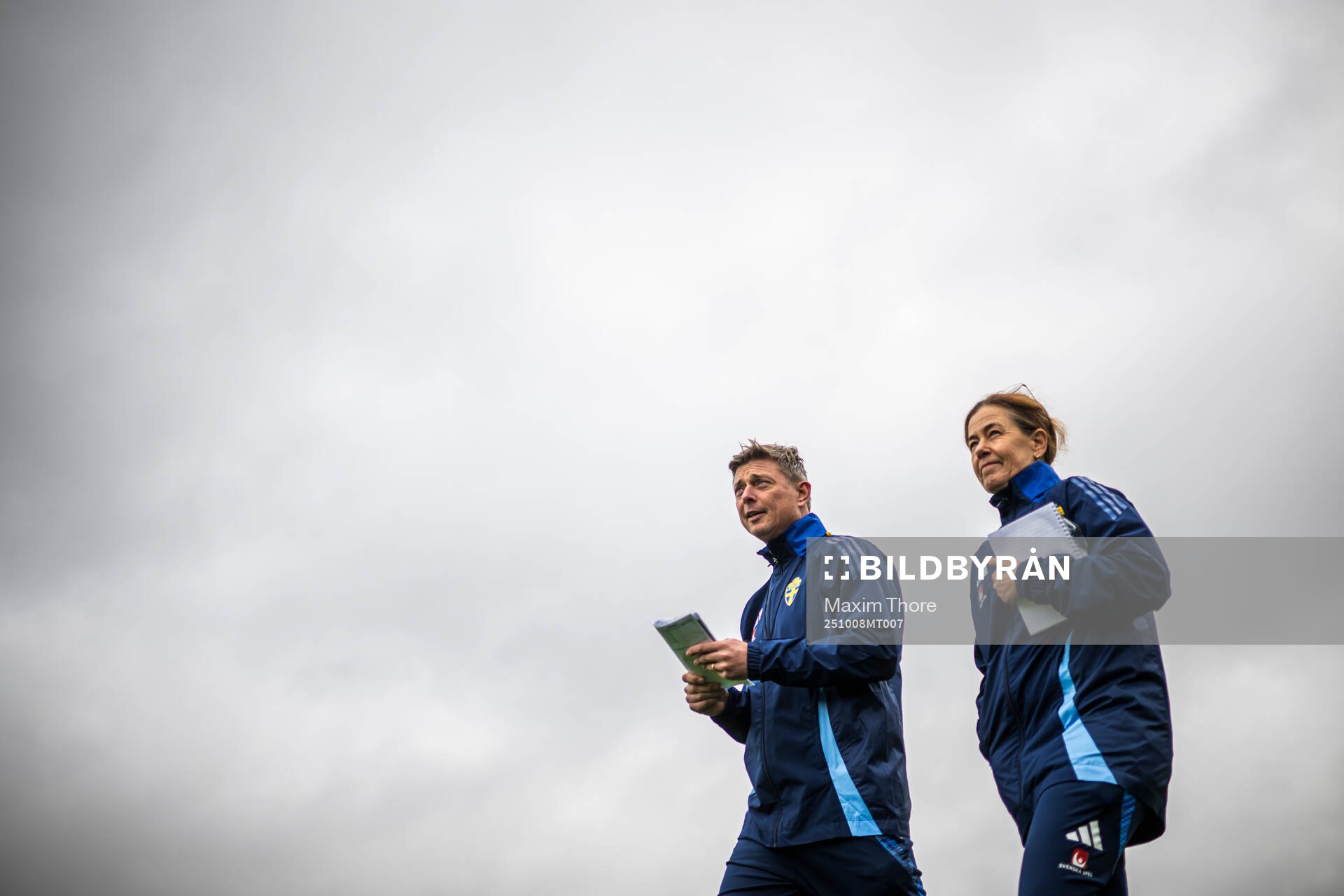 Head coach Jon Dahl Tomasson and media officer Petra