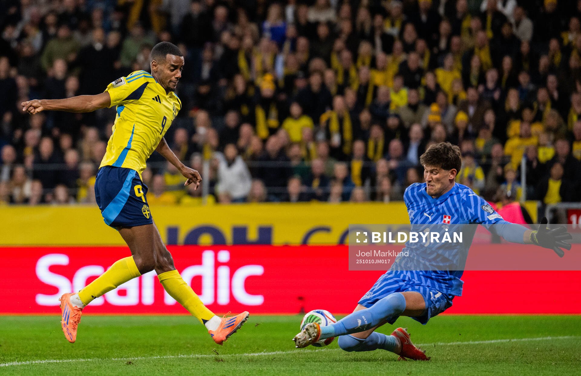 Alexander Isak of Sweden against goalkeeper Gregor Kobel of