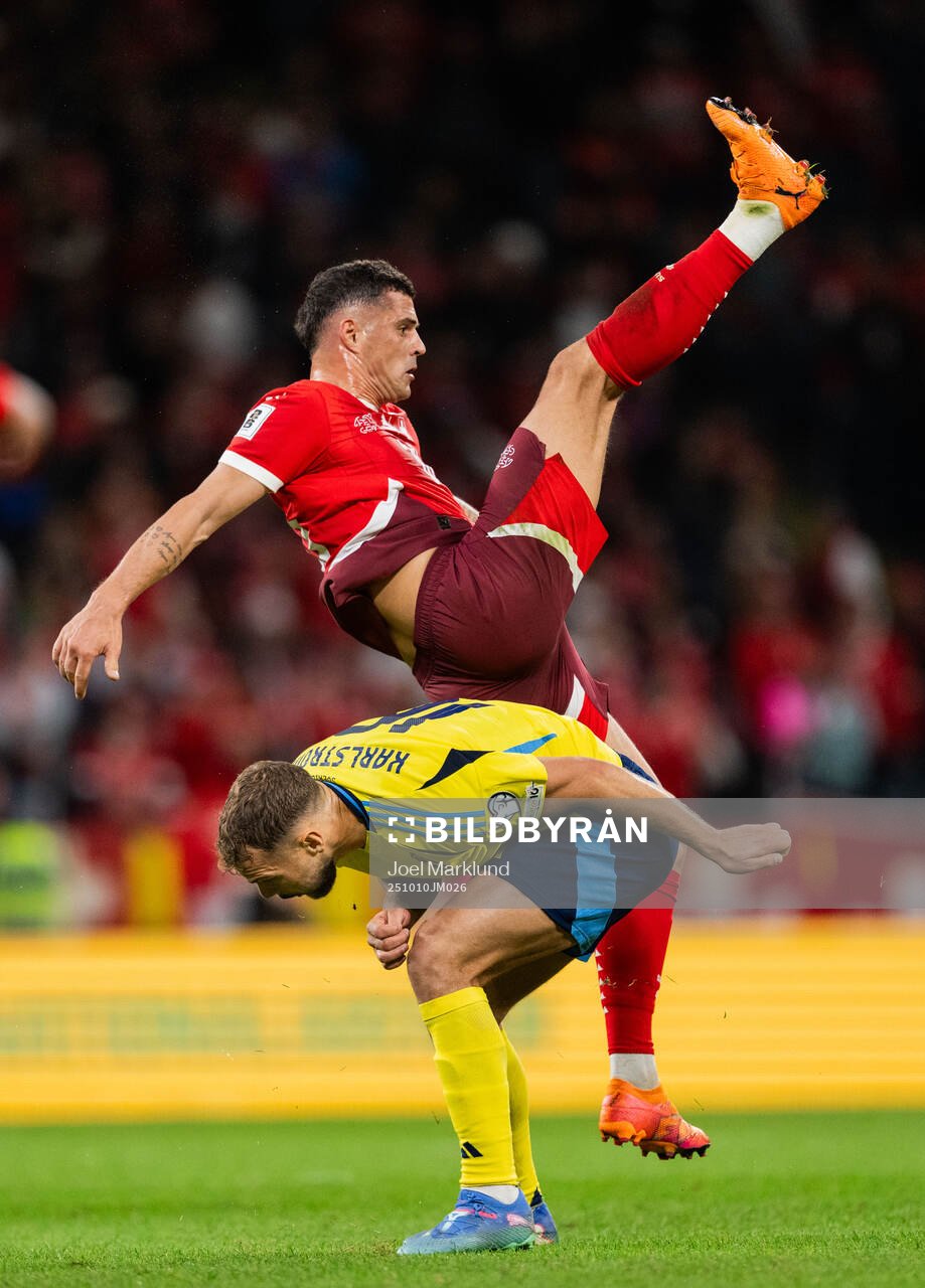 Jesper Karlström of Sweden and Granit Xhaka of Switzerland