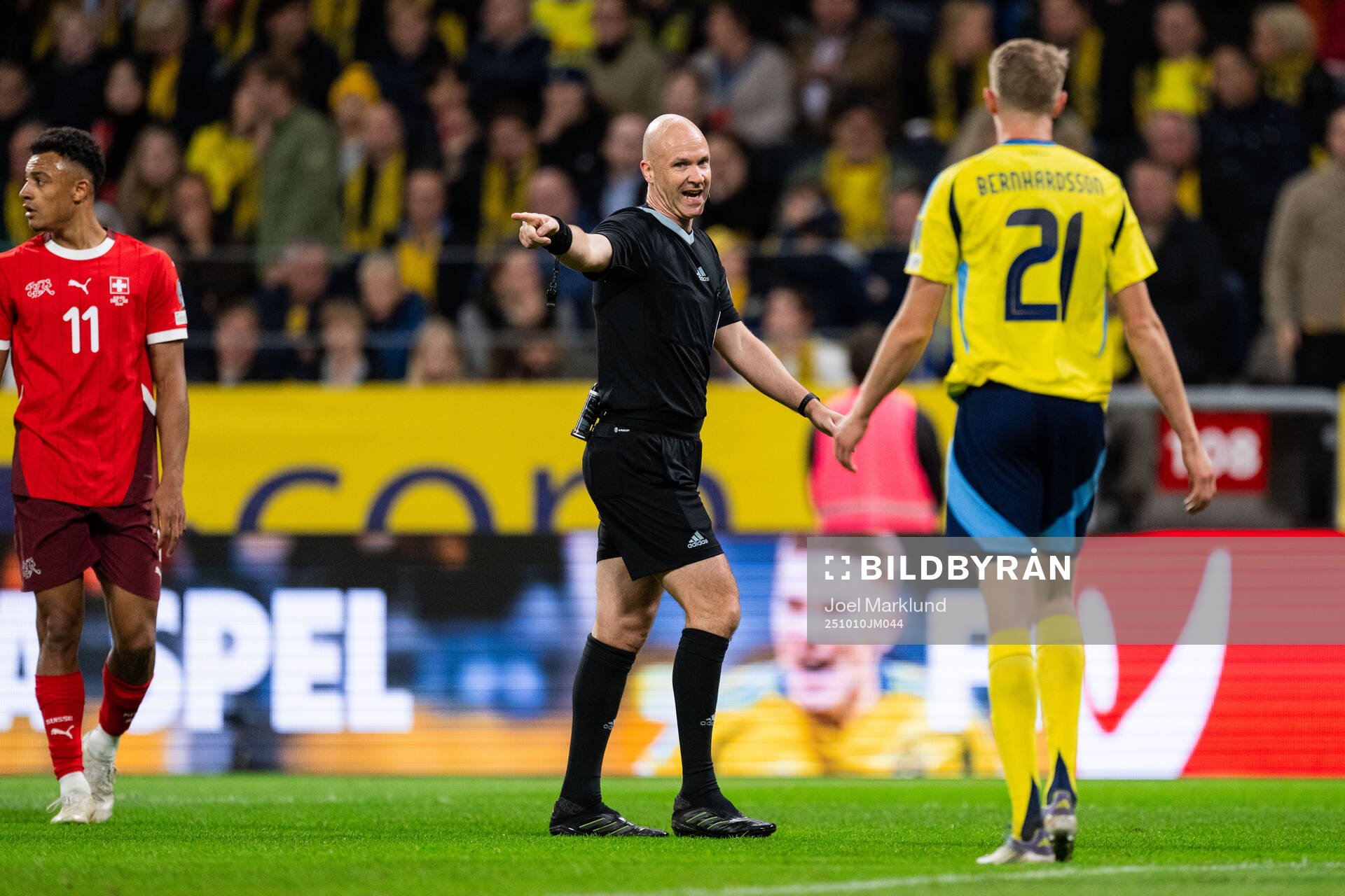 Referee Anthony Taylor and Alexander Bernhardsson of Sweden