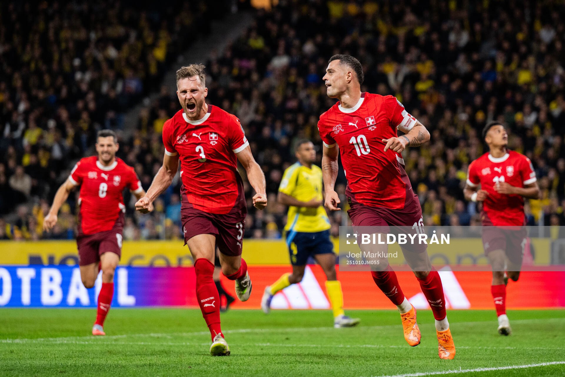 Silvan Widmer and Granit Xhaka of Switzerland celebrating