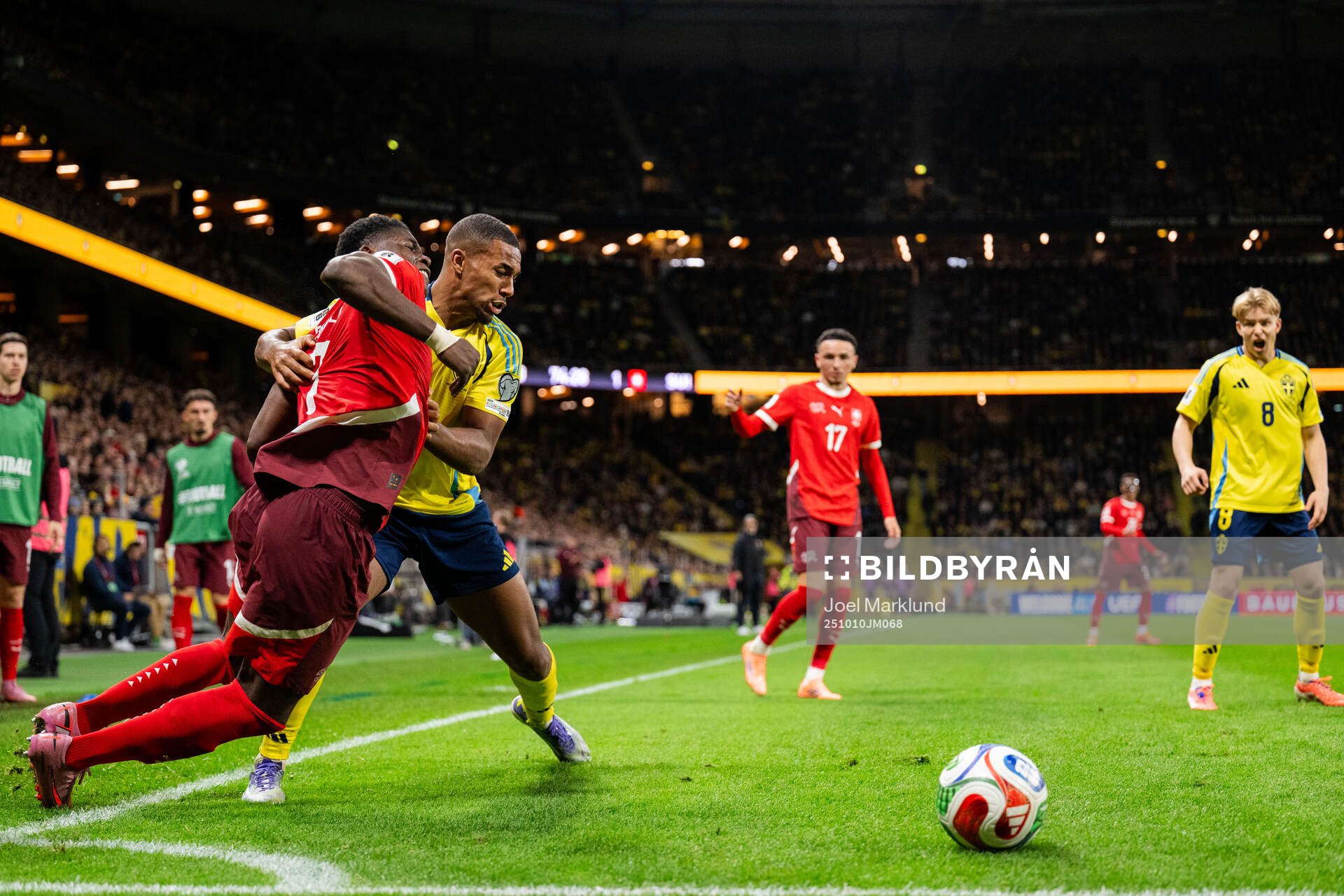 Breel Embolo of Switzerland and Isak Hien of Sweden
