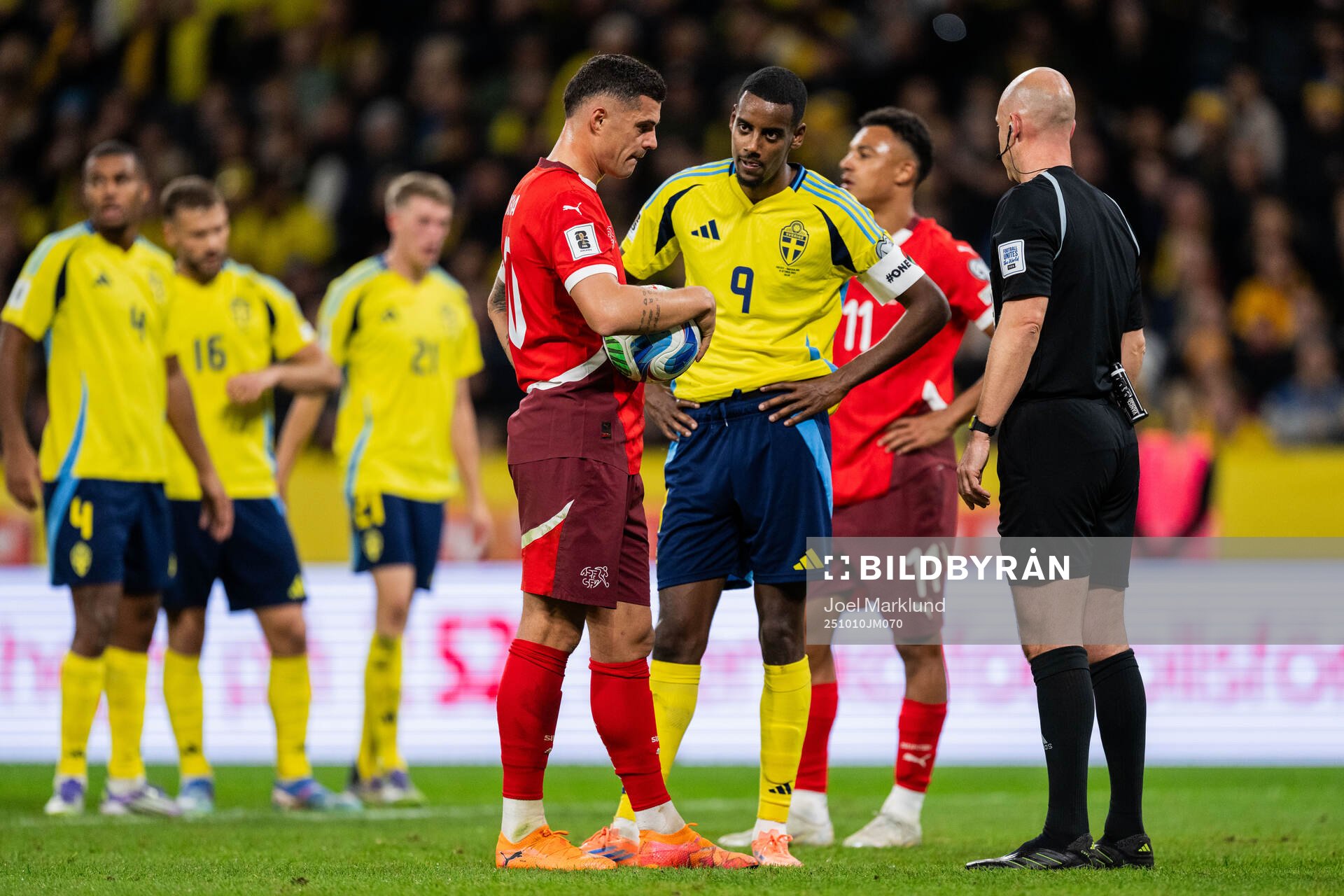 Granit Xhaka of Switzerland and Alexander Isak of Sweden