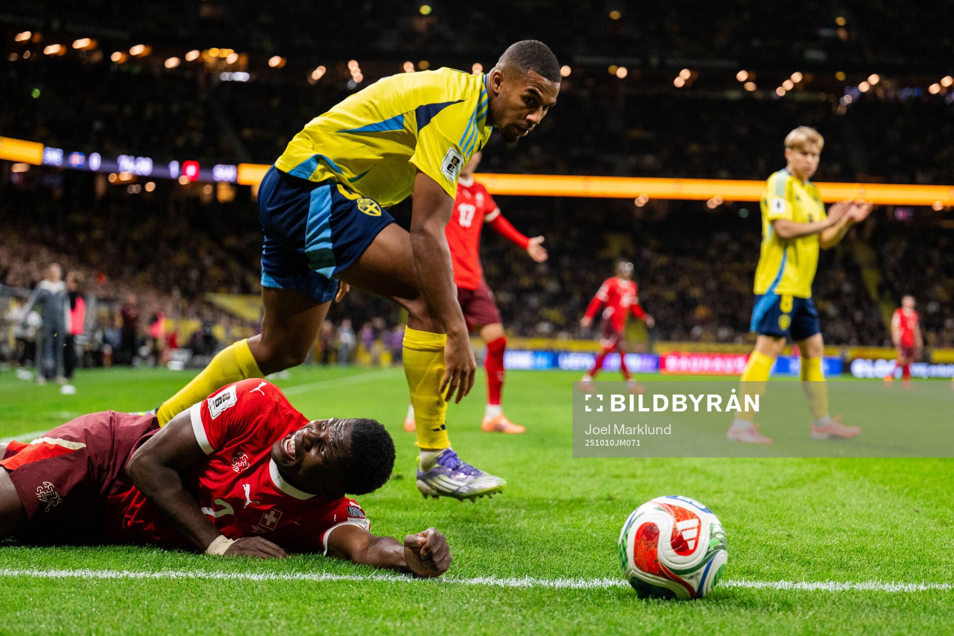 Breel Embolo of Switzerland and Isak Hien of Sweden