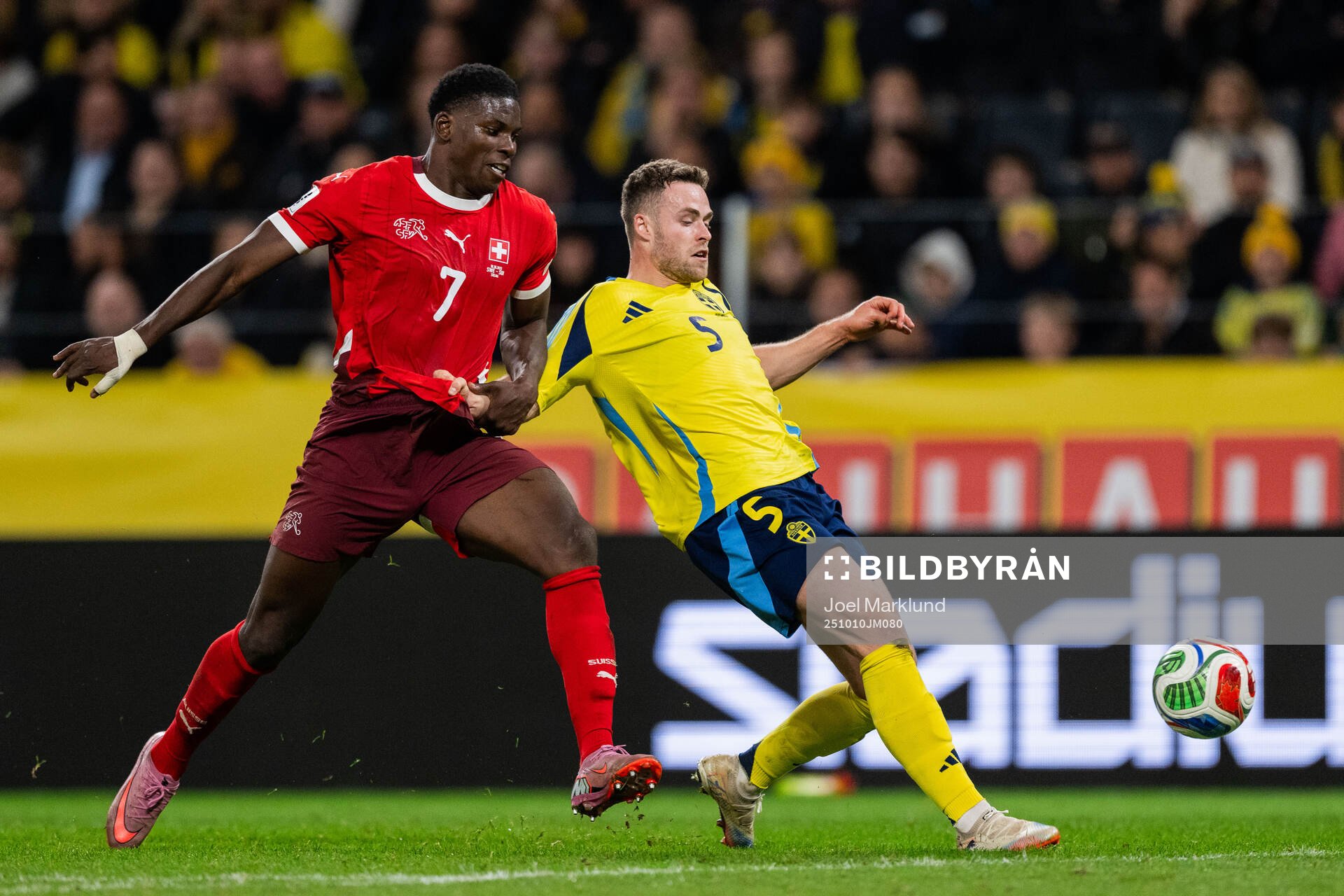 Breel Embolo of Switzerland and Gabriel Gudmundsson of