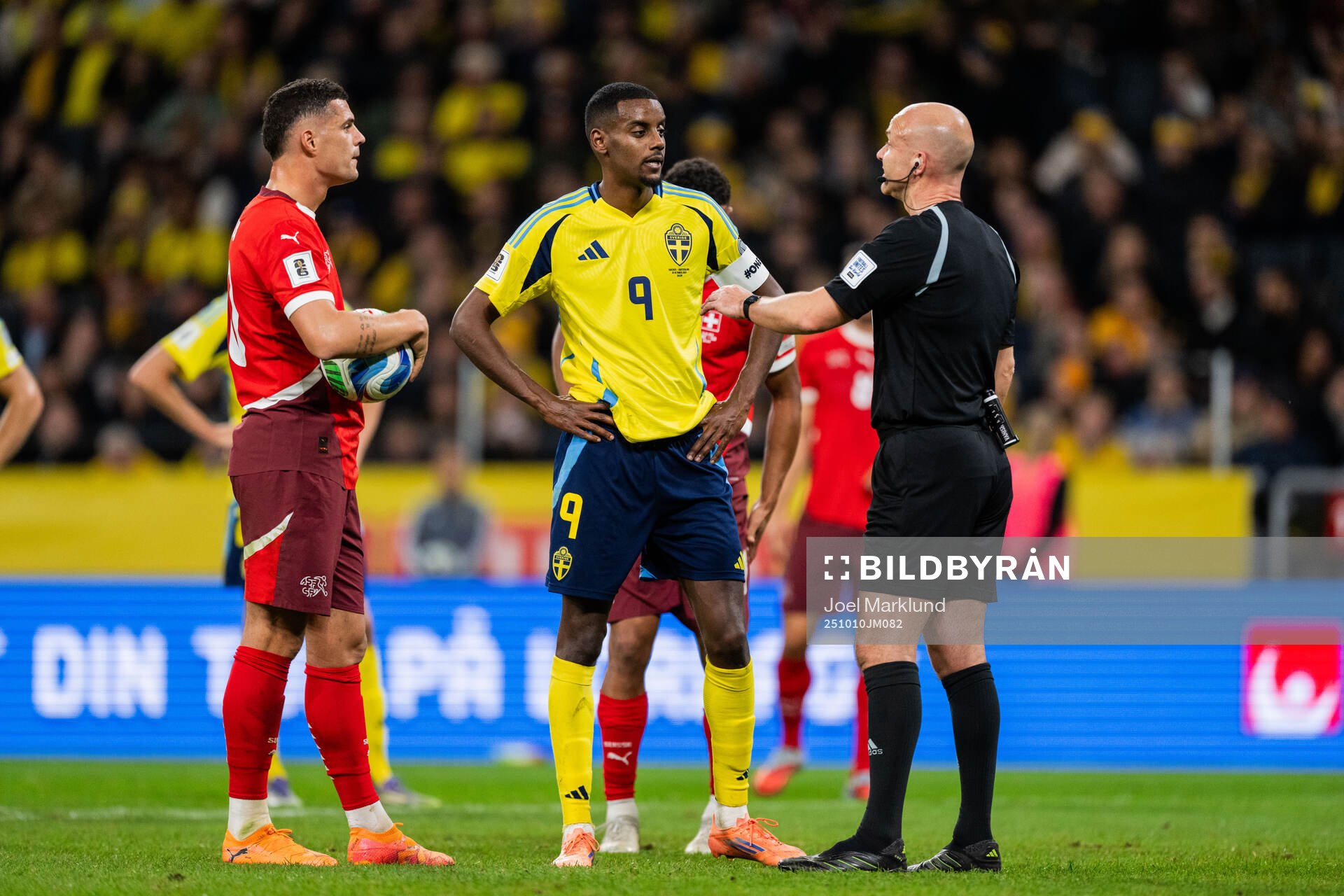 Granit Xhaka of Switzerland, Alexander Isak of Sweden and