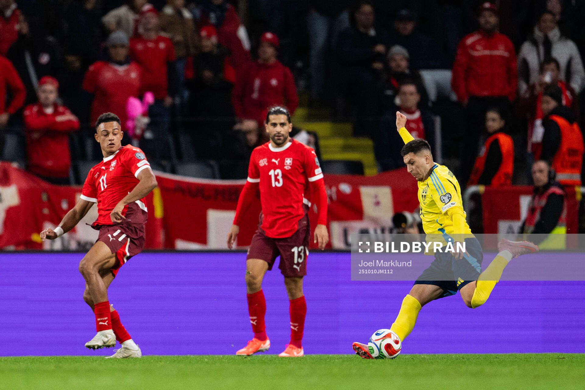 Dan Ndoye and Ricardo Rodriguez of Switzerland and Roony