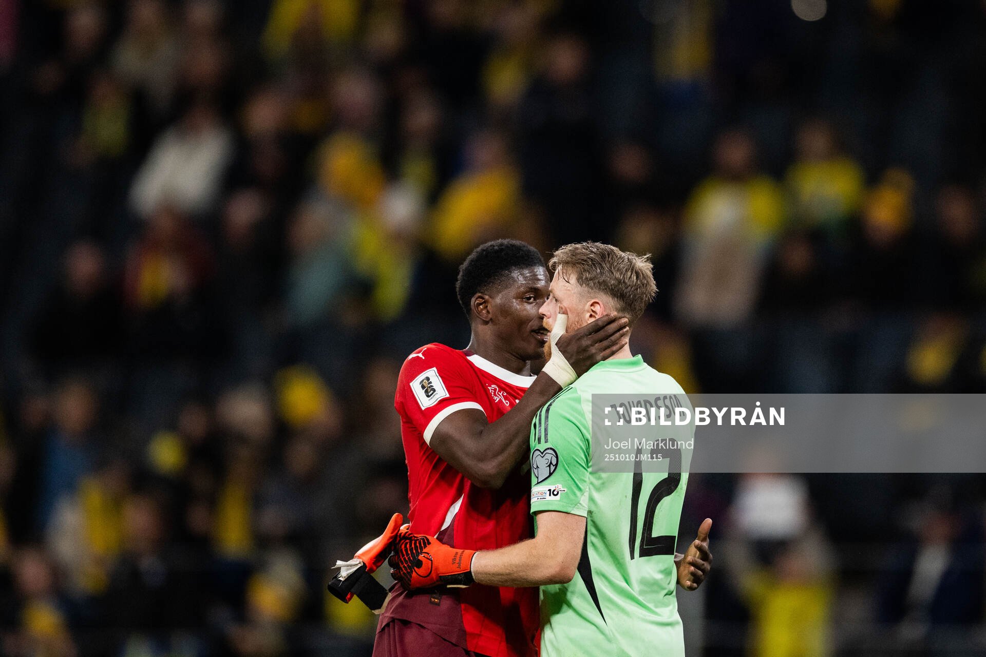 Breel Embolo of Switzerland and goalkeeper Viktor Johansson