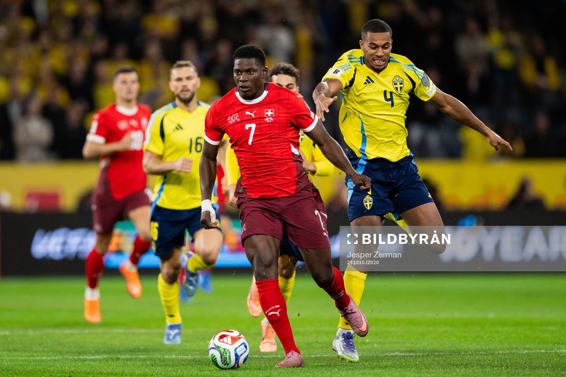 Breel Embolo of Switzerland and Isak Hien of Sweden