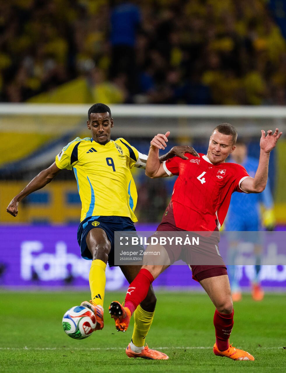 Alexander Isak of Sweden and Nico Elvedi of Switzerland
