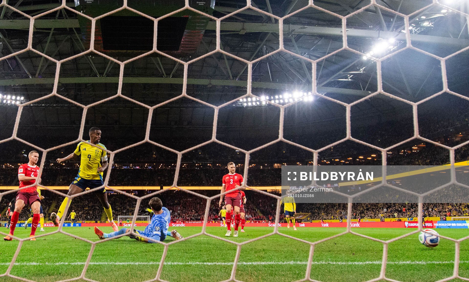 Alexander Isak of Sweden and goalkeeper Gregor Kobel of