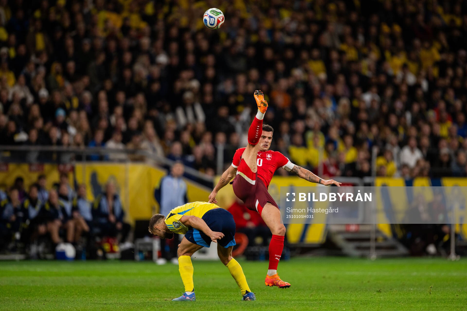 Jesper Karlström of Sweden and Granit Xhaka of Switzerland