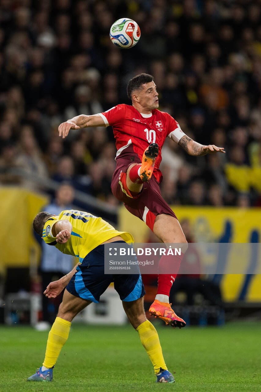 Jesper Karlström of Sweden and Granit Xhaka of Switzerland