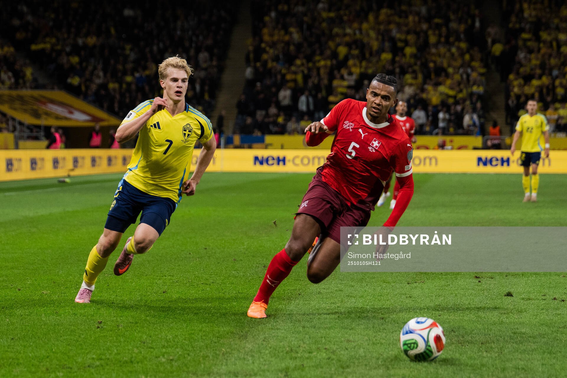 Lucas Bergvall of Sweden and Manuel Akanji of Switzerland