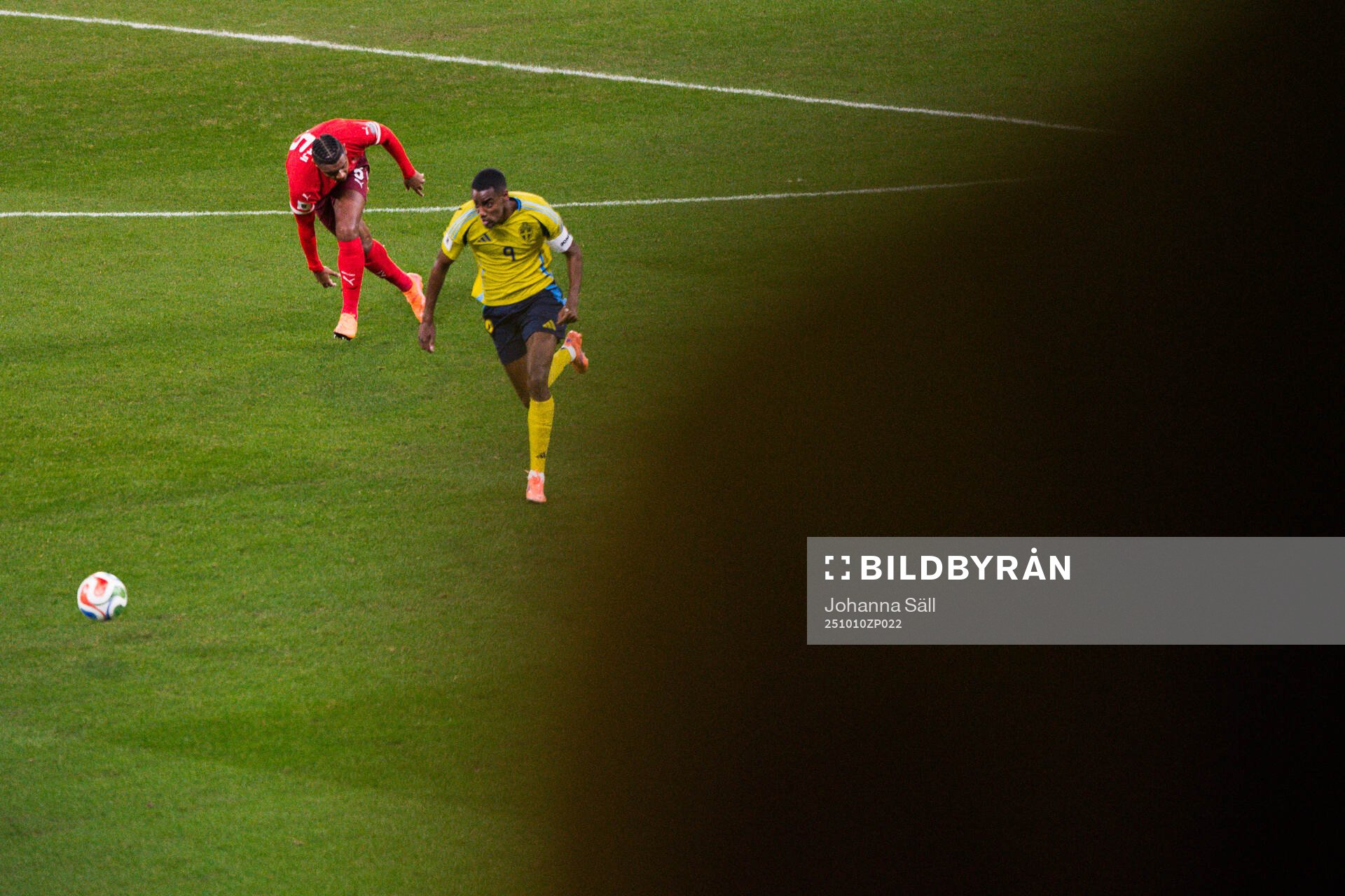 Manuel Akanji of Switzerland and Alexander Isak of Sweden