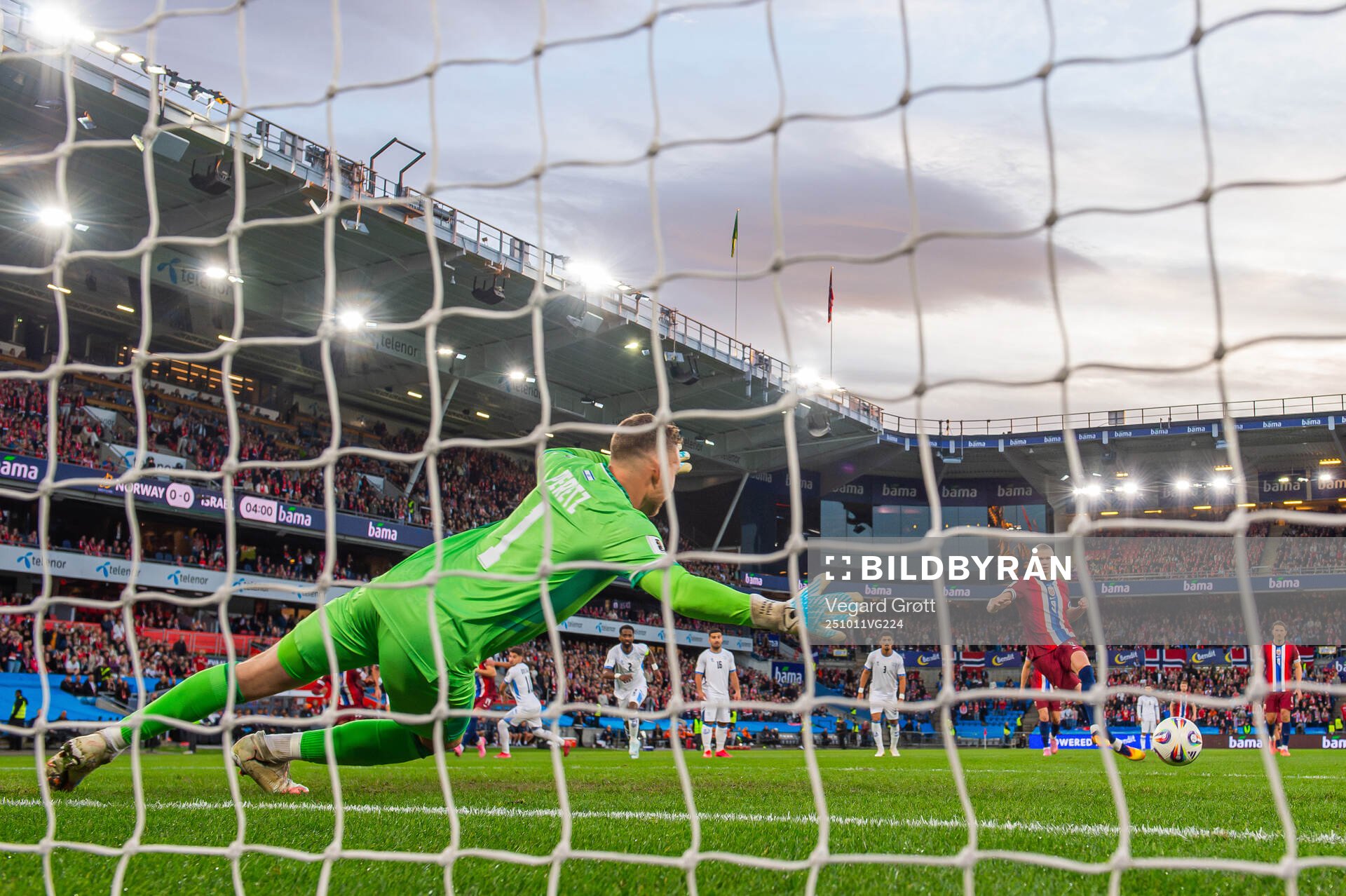 Goalkeeper Daniel Peretz of Israel saves the penalty kick