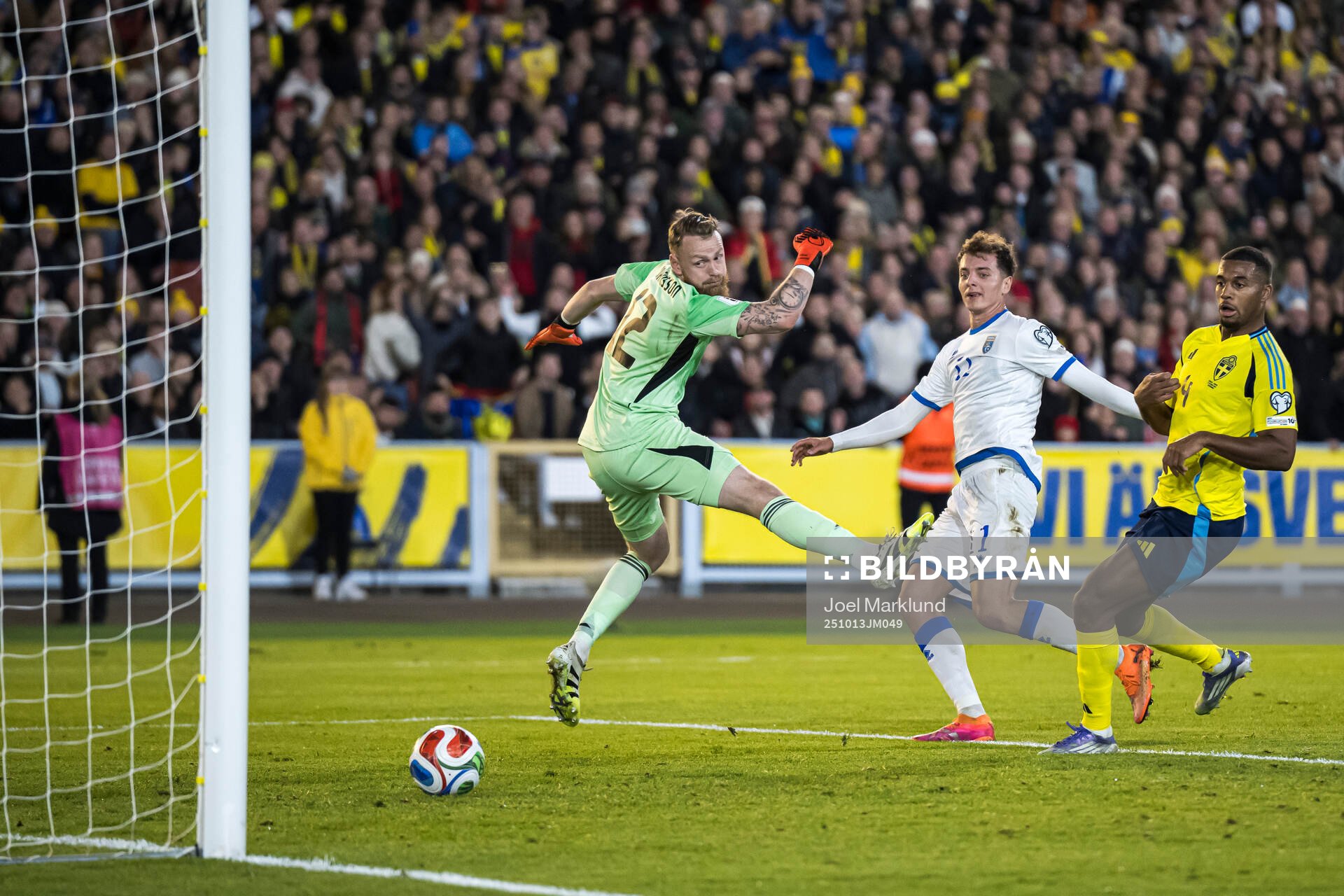 Fisnik Asllani of Kosovo scores the 0-1 goal behind